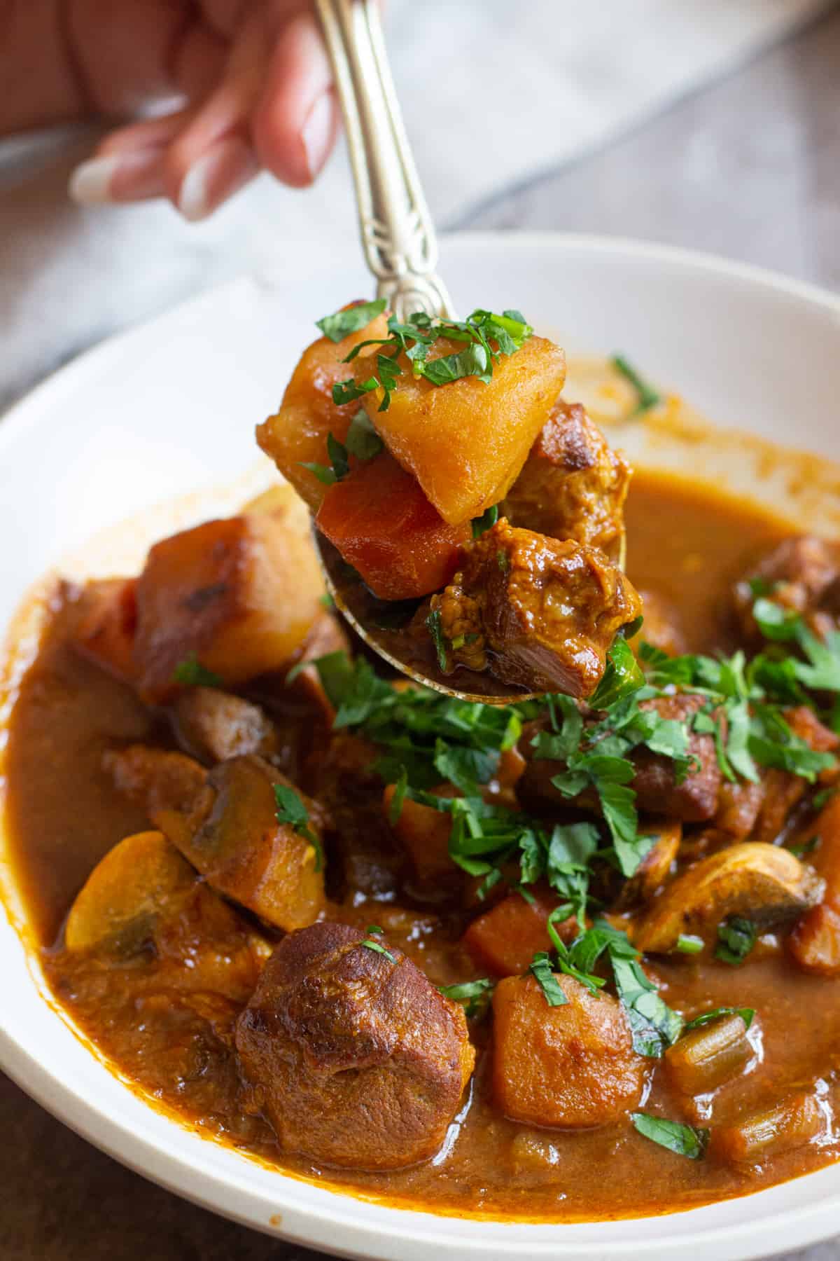 serve lamb and potato stew warm with parsley. 