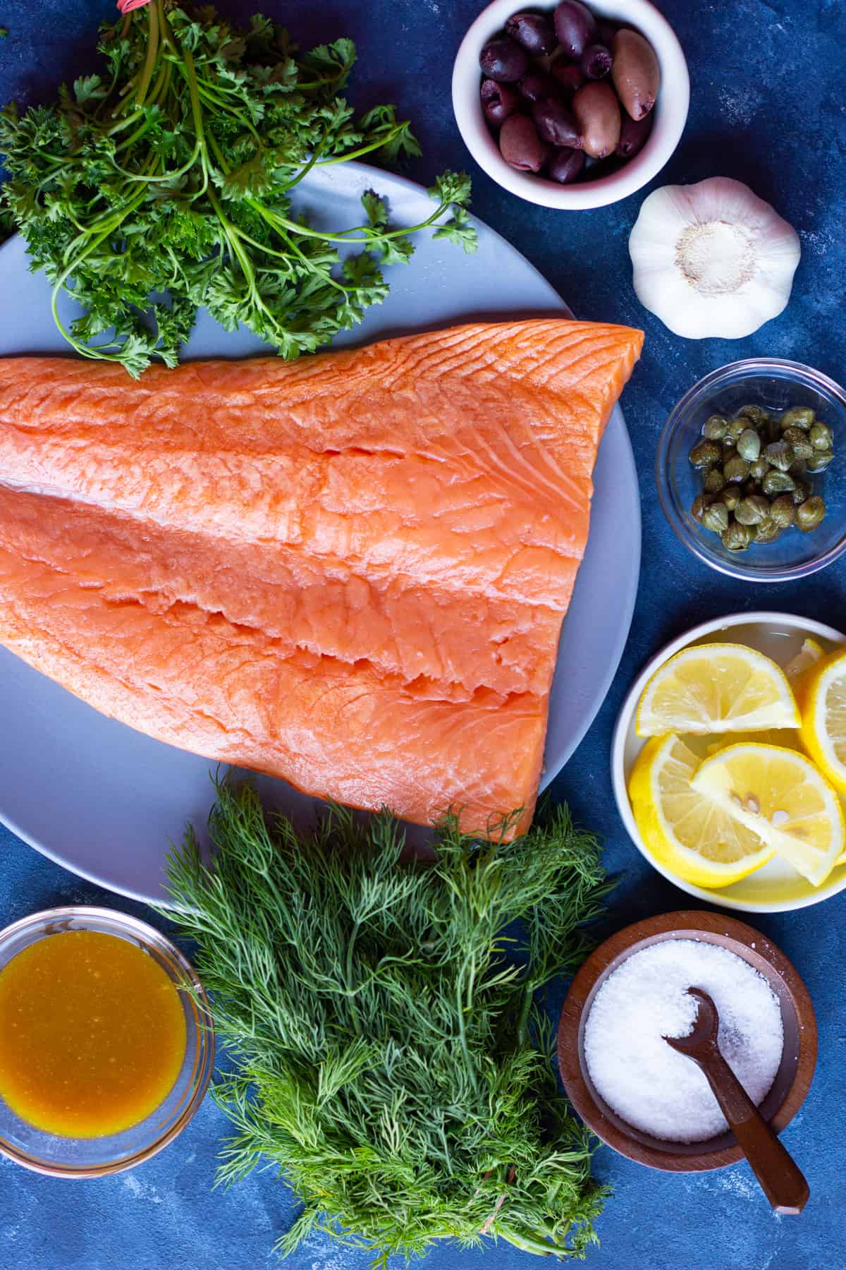 ingredient shot includes salmon, capers, lemon, olives, garlic and dijon mustard.