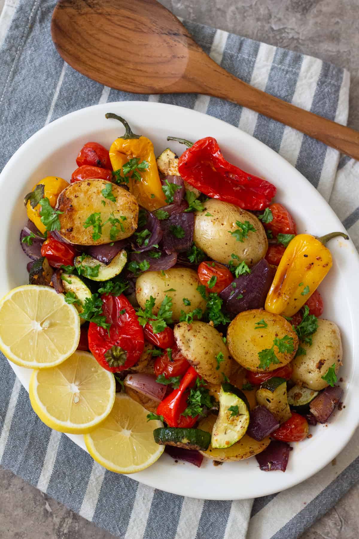Mediterranean style oven roasted vegetables are so simple, yet hearty and delicious. They make for a wonderful side dish that's packed with flavor.
