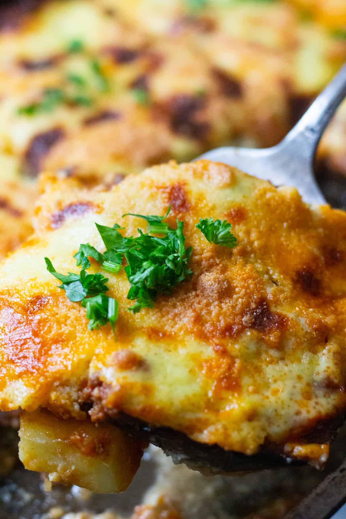 A slice of moussaka in the pan. 