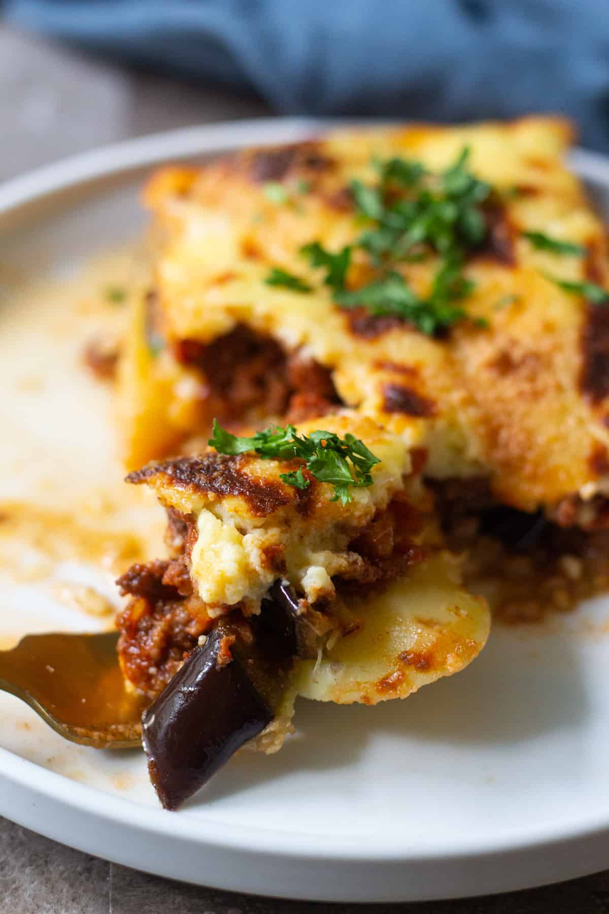 A bite of greek eggplant dish 