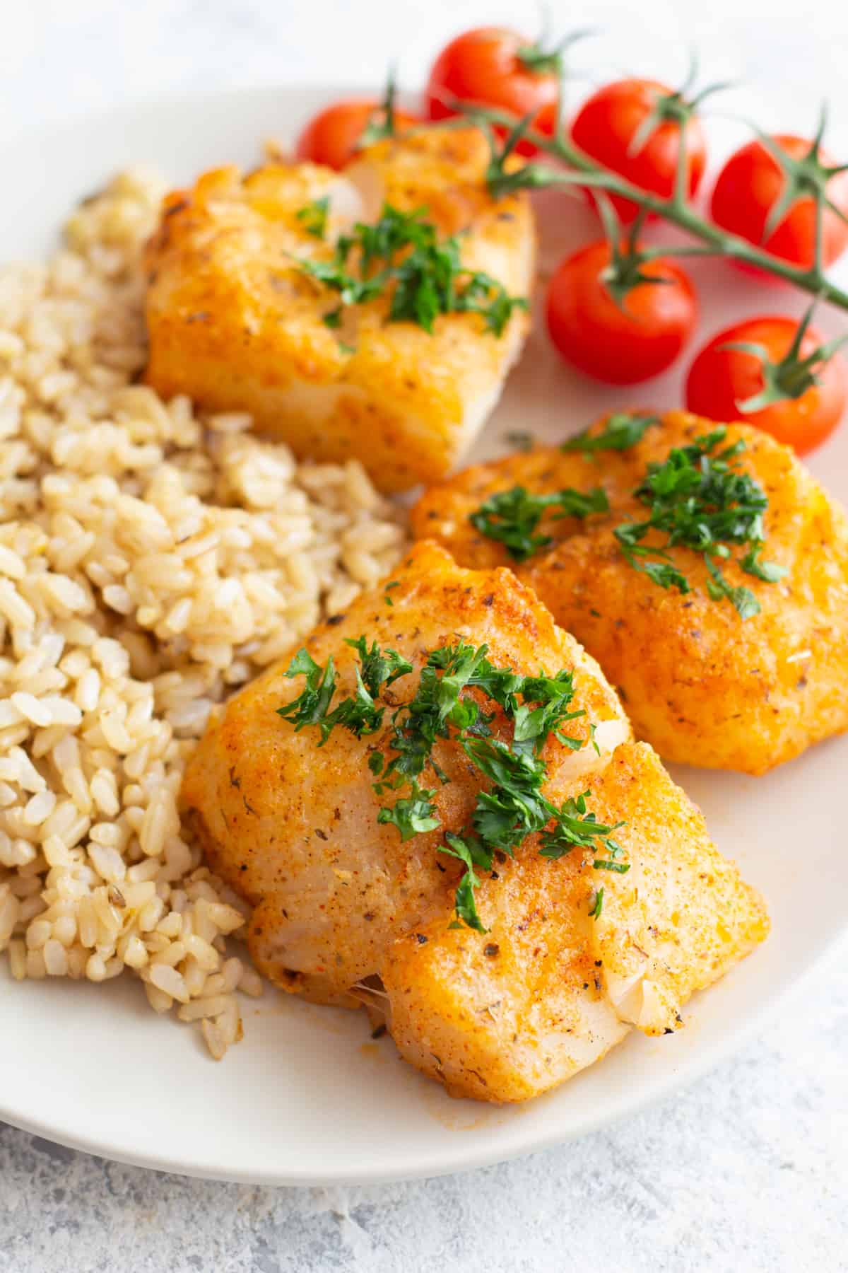 Delicious parmesan baked cod served with brown rice. 