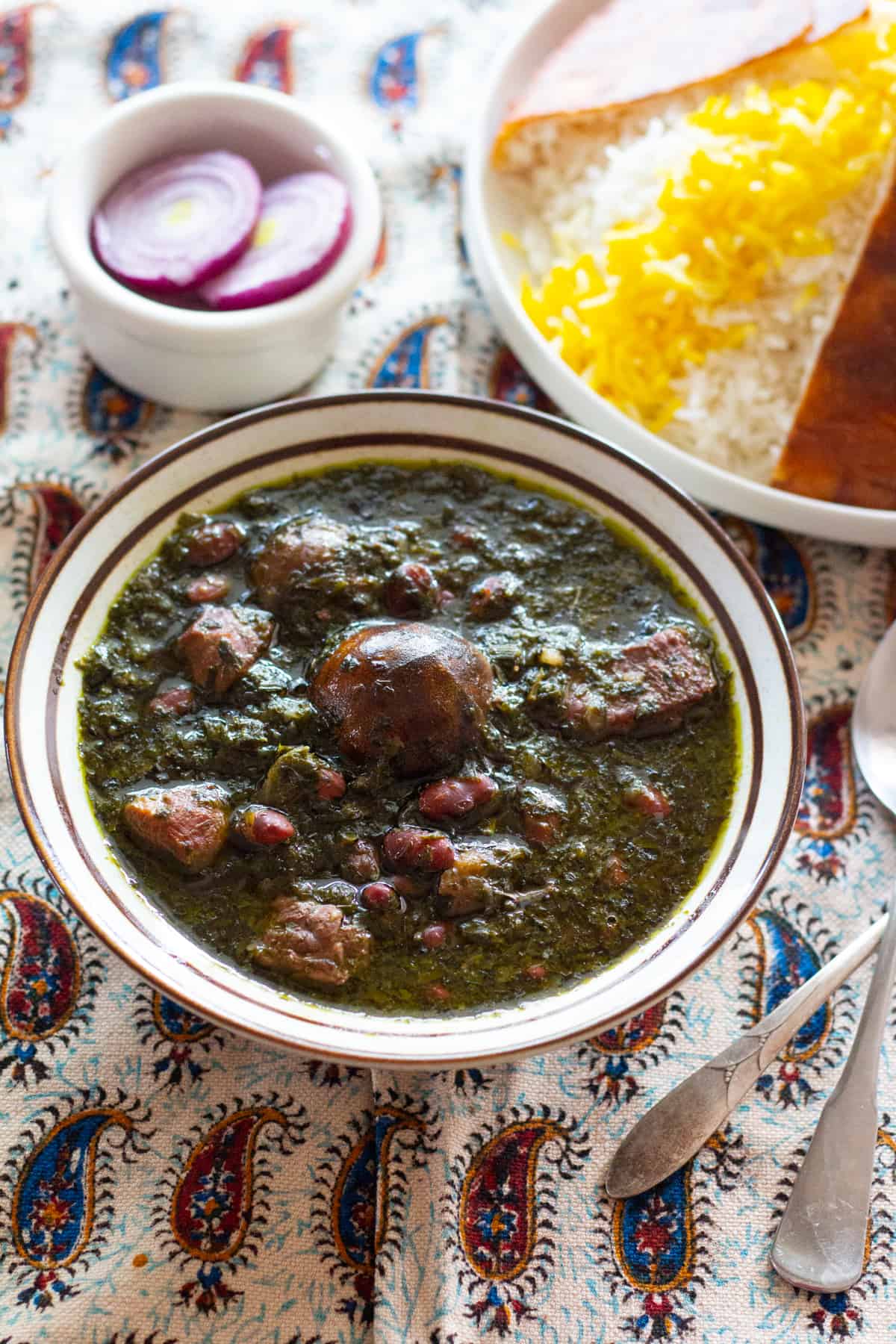 Ghormeh Sabzi - Saute herbs until they're aromatic but not burnt. Saute onion and beef, add water and cook.