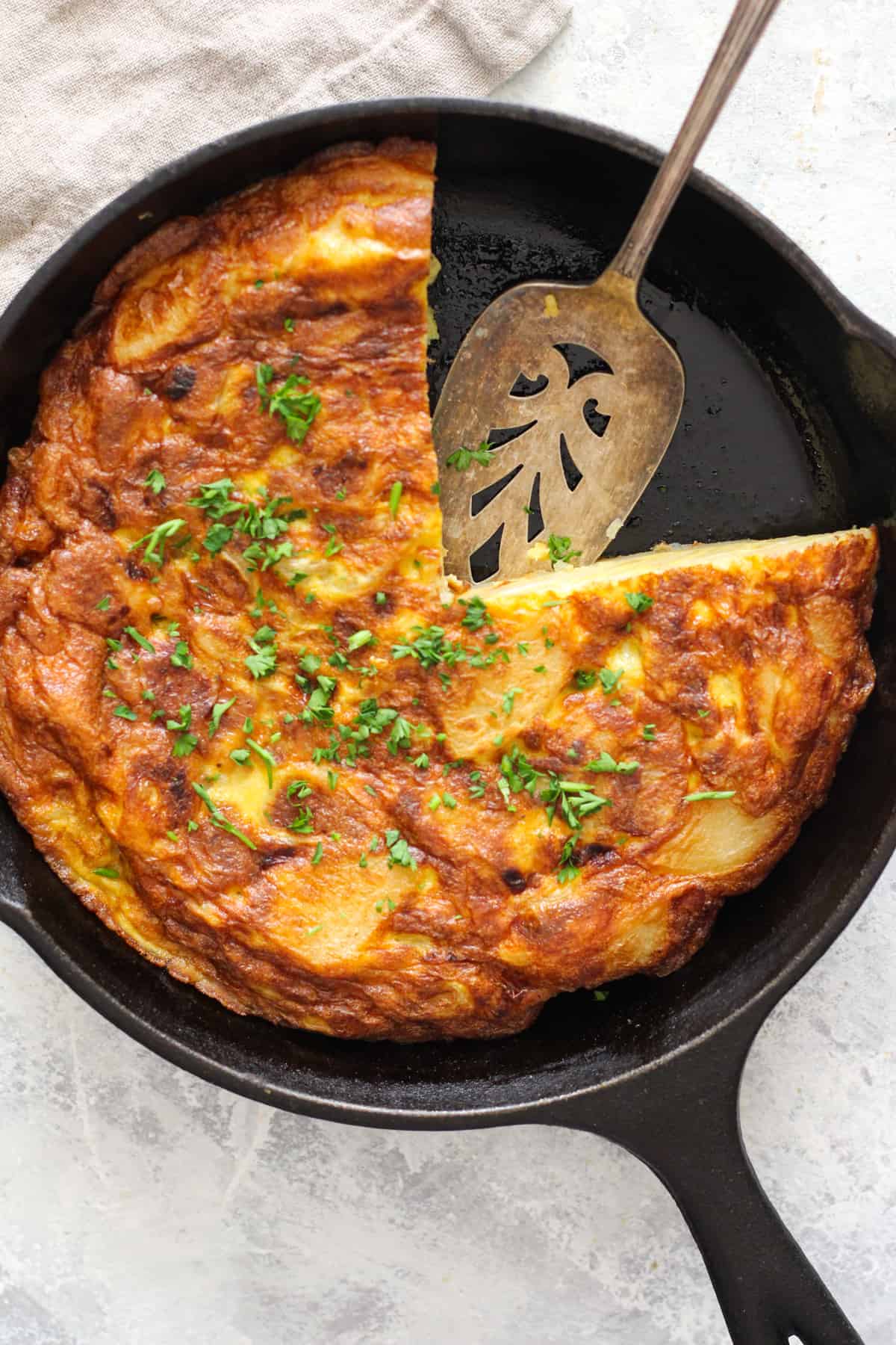 You can make this Spanish omelette in a cast iron. If cooked properly, Spanish tortilla is easy to slice and serve. 
