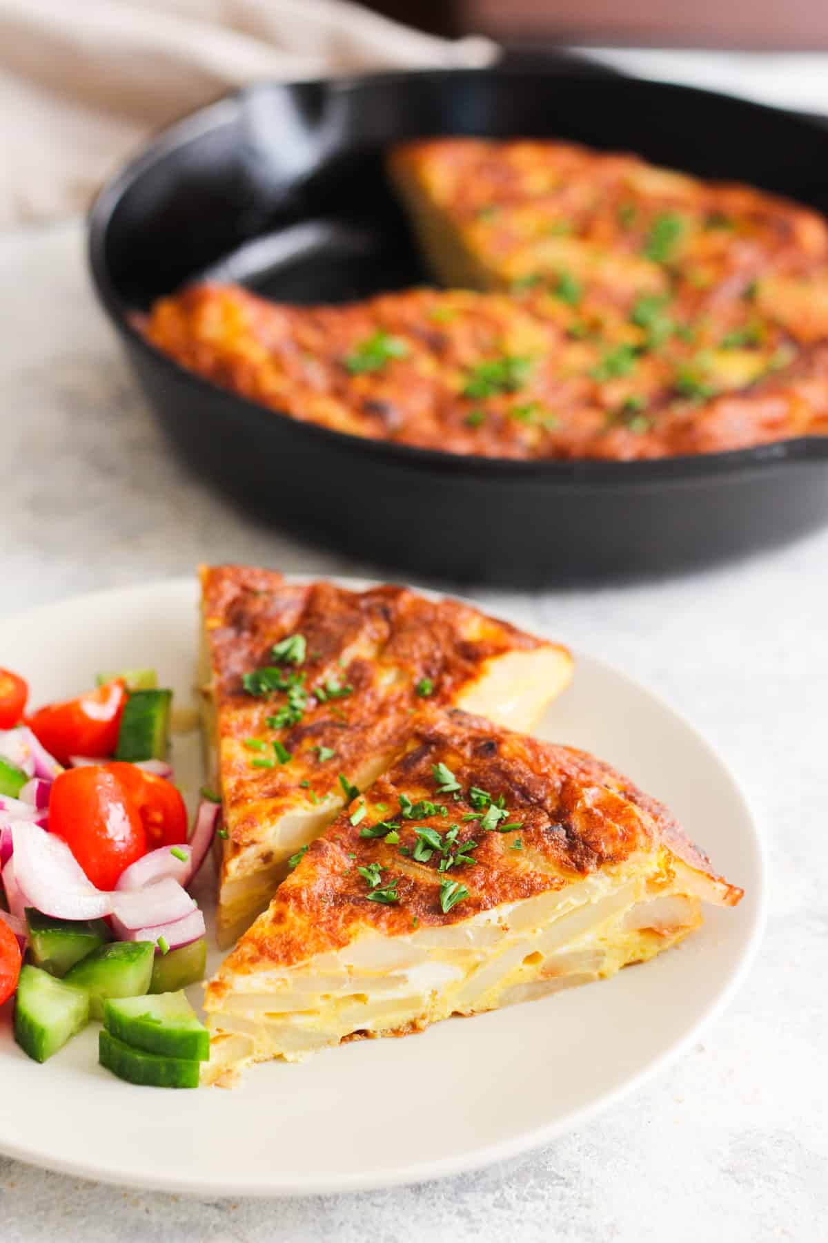 This Spanish tortilla recipe is a classic. Also known as tortilla espanola, this easy Spanish potato omelette is so easy yet very satisfying. You're only four ingredients and a skillet away from one of the most popular Spanish dishes! 
