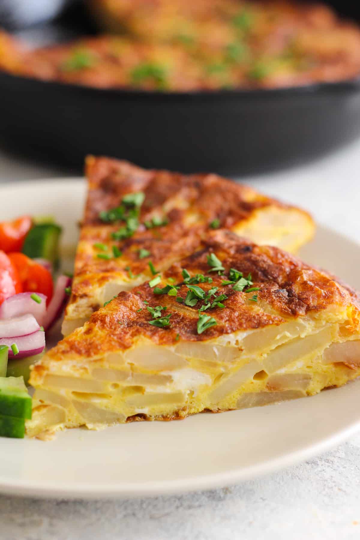 Spanish tortilla recipe is easy and very tasty. The slices show the potatoes beautifully.