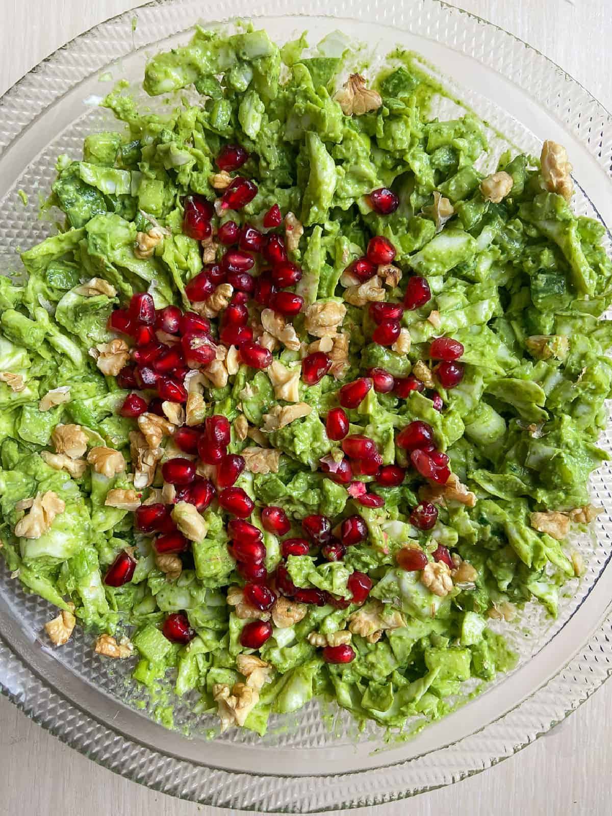 to add more color and flavor, top the salad with pomegranates and walnuts. 
