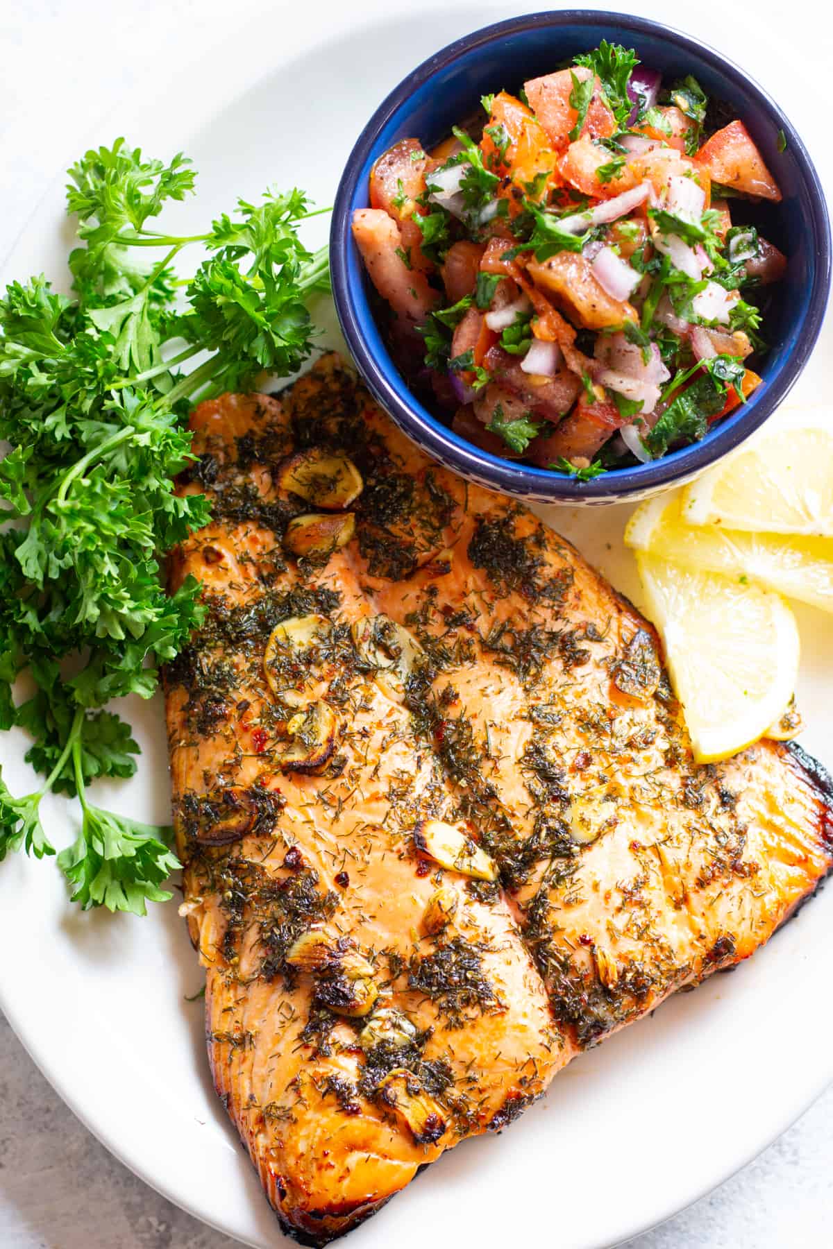 You can serve this marinated baked salmon with a quick tomato salad.