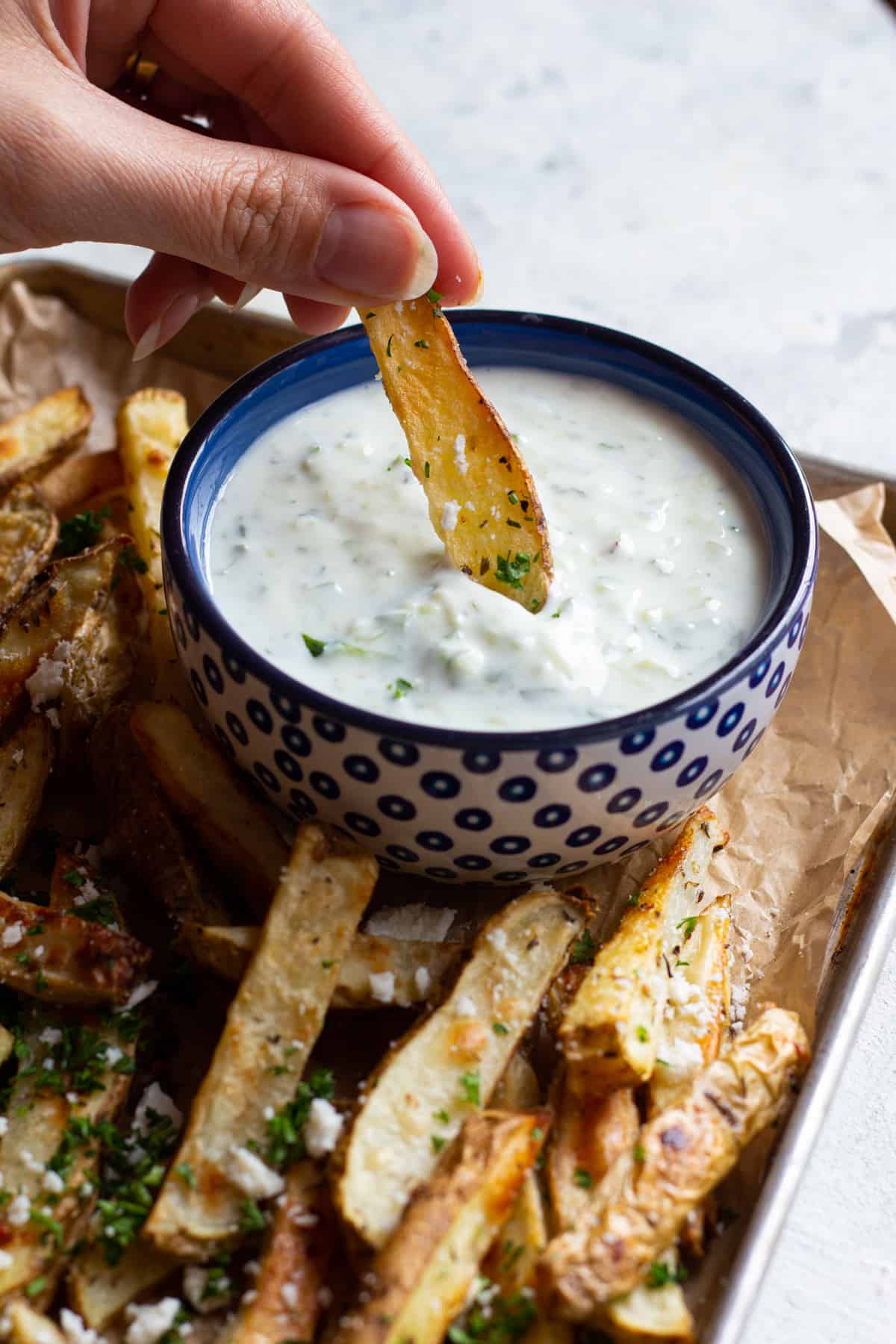 Serve the fries with some homemade tzatziki as a dip. 