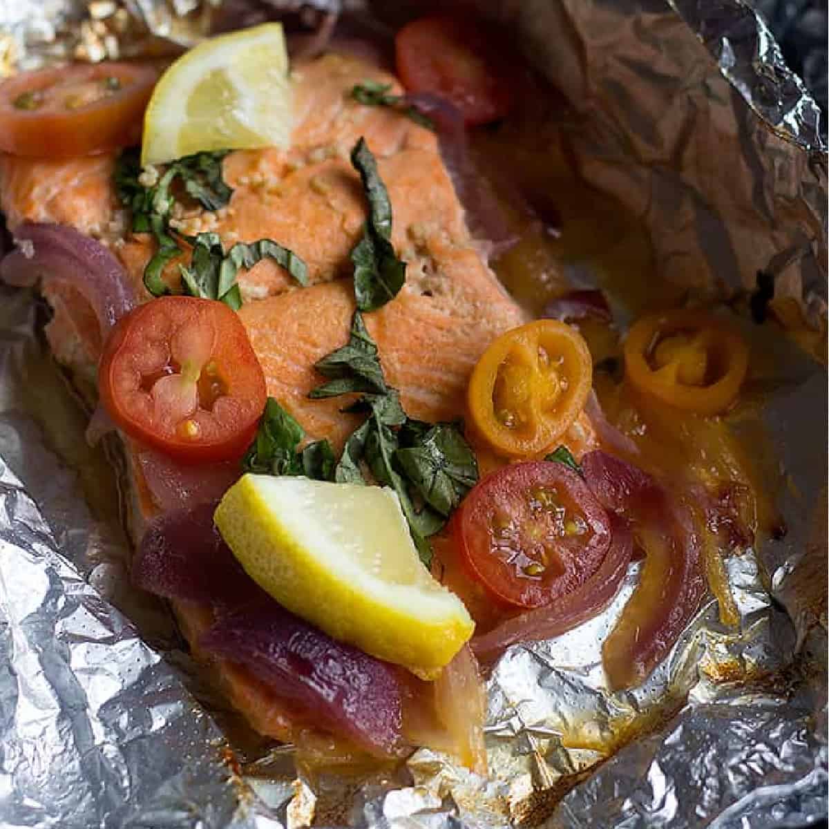 Baked salmon in foil is a simple weeknight dinner recipe. Made with a tasty honey lemon sauce, this salmon recipe is a keeper. 