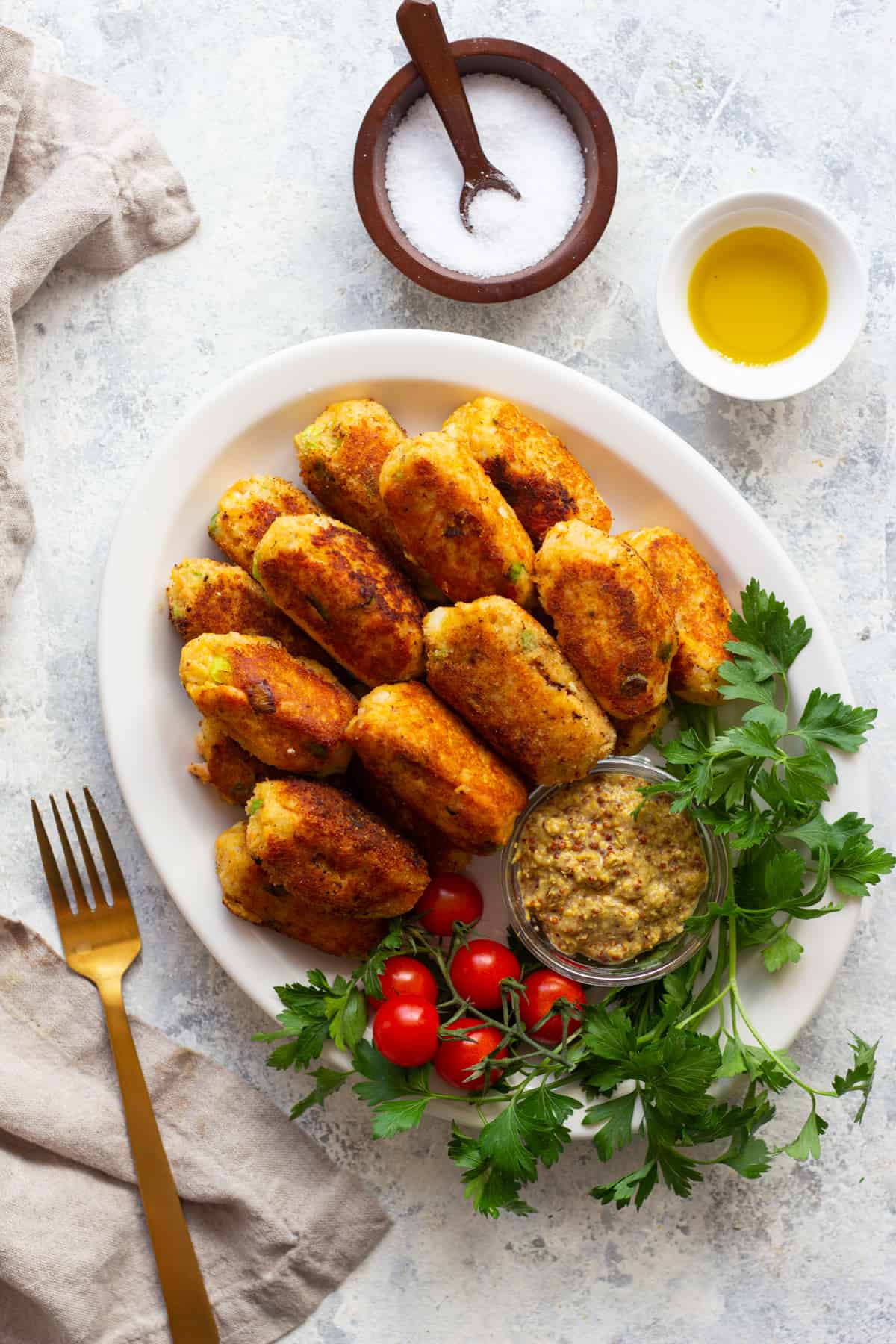 Salmon croquettes may sound fancy but they're so easy to make. This salmon croquettes recipe is an easy way to use up leftover salmon and make it into a delicious appetizer or light dinner. 
