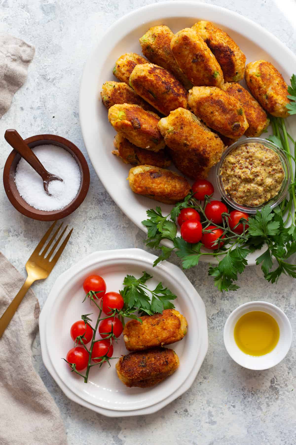 Salmon croquettes may sound fancy but they're so easy to make. This salmon croquettes recipe is an easy way to use up leftover salmon and make it into a delicious appetizer or light dinner. 
