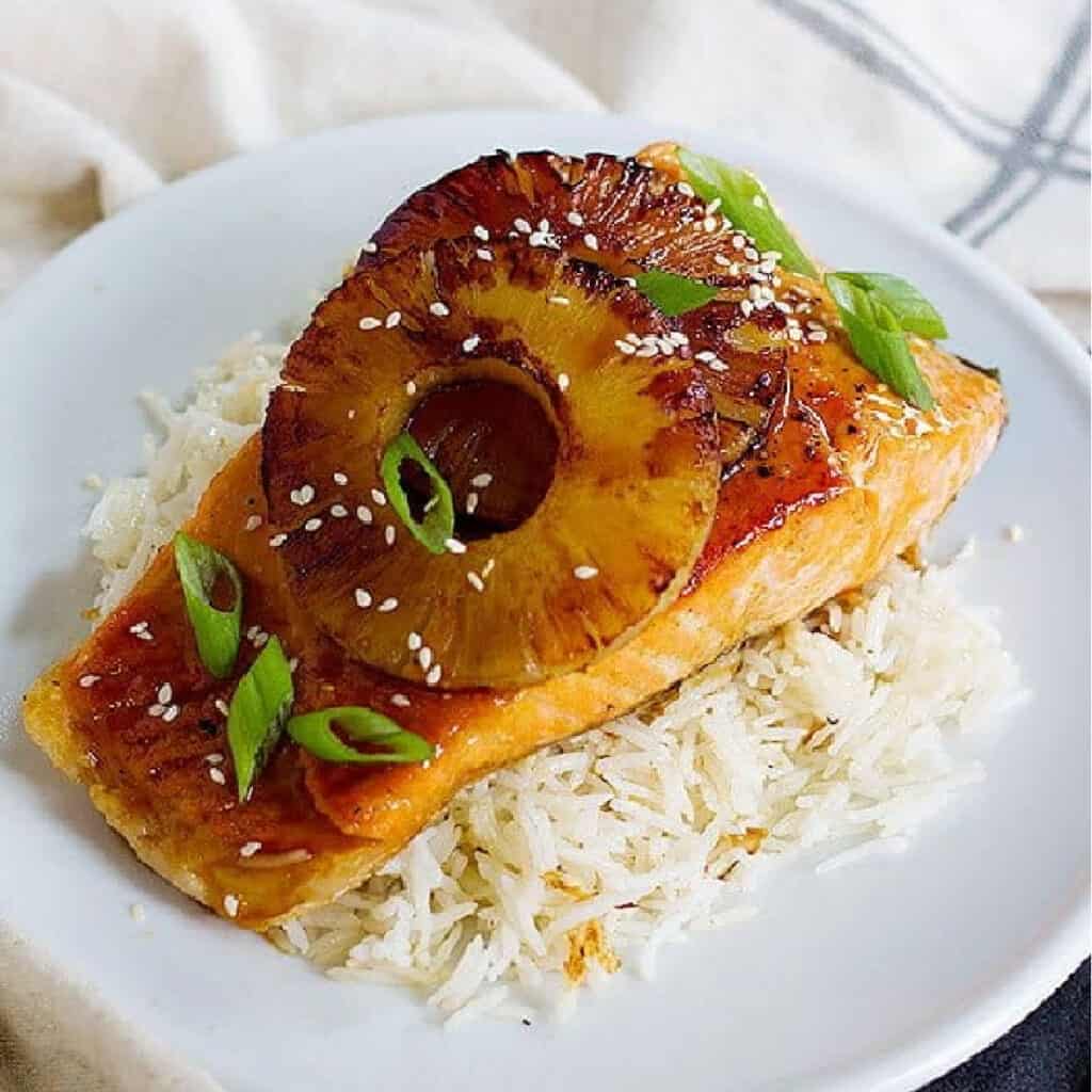 Give your usual seafood recipe a great twist with this teriyaki pineapple salmon. Fresh pan seared salmon smothered in delicious sweet and tangy sauce topped with caramelized pineapple!