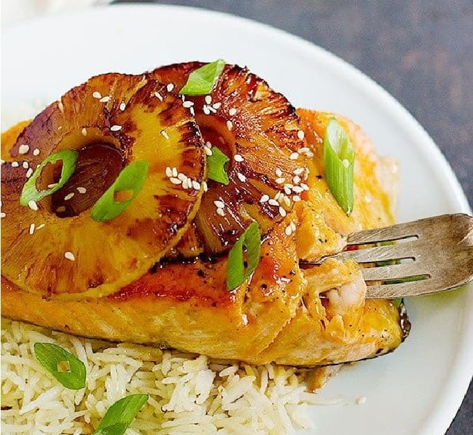 Give your usual seafood recipe a great twist with this teriyaki pineapple salmon. Fresh pan seared salmon smothered in delicious sweet and tangy sauce topped with caramelized pineapple!
