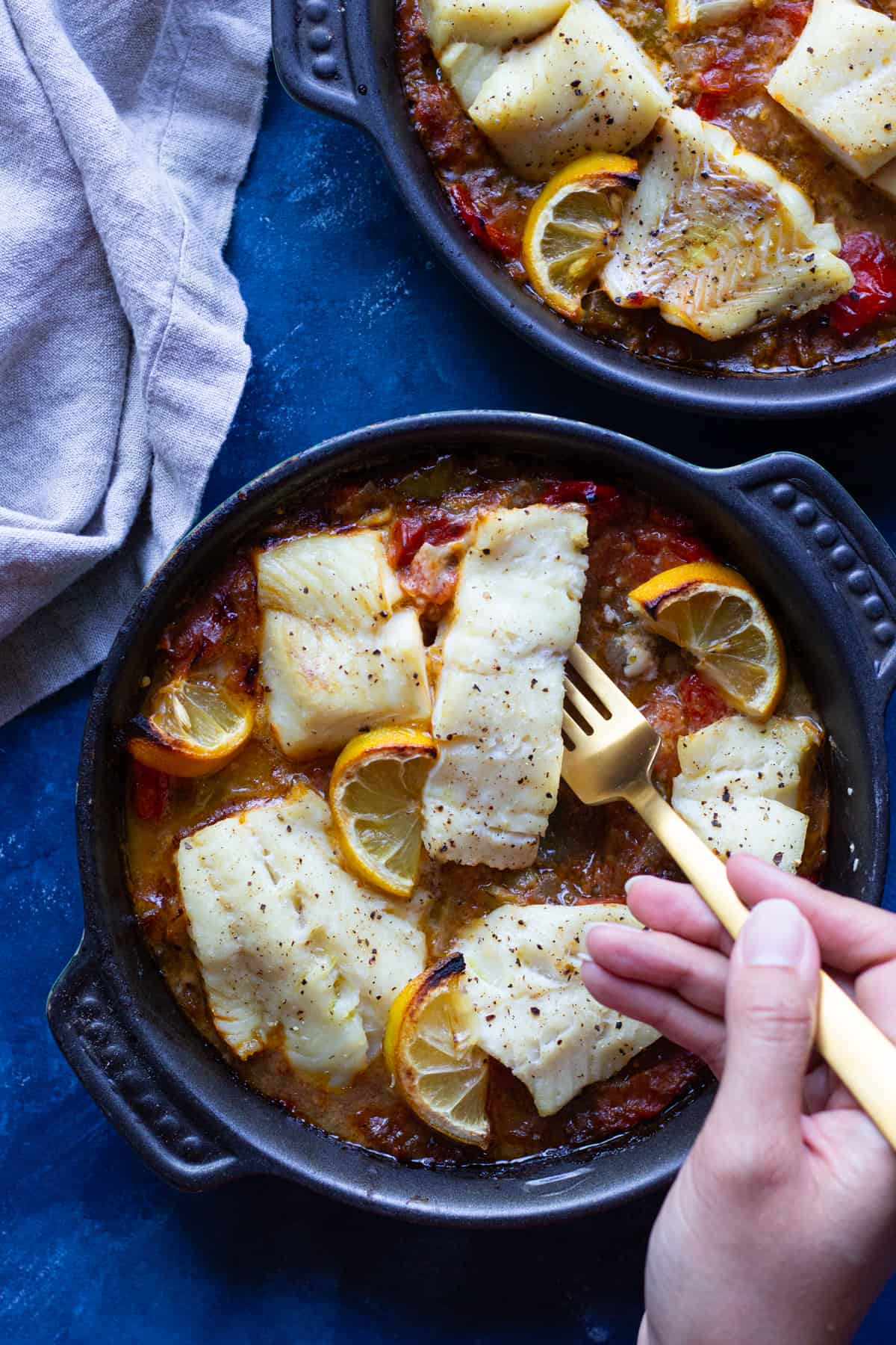 This baked cod recipe is a keeper. Tender baked cod fillets are made with vegetables such as onions and tomatoes for maximum flavor.