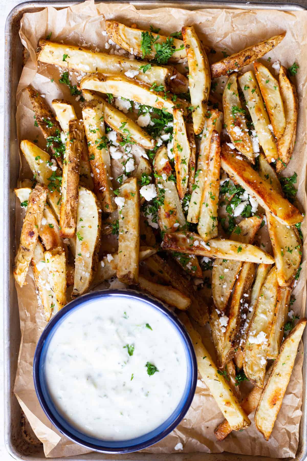 These are the best Greek fries ever, topped with feta cheese and parsley.