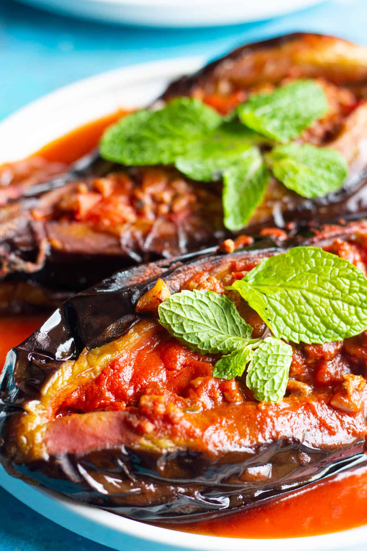 Eggplant stuffed with meat and topped with mint. 
