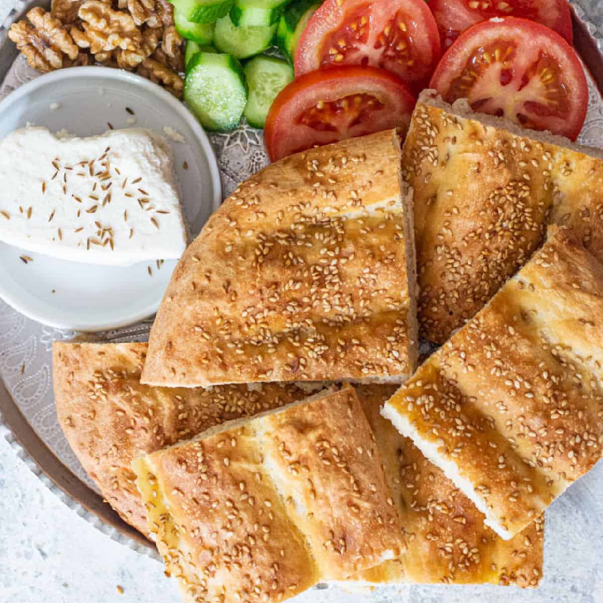 Nan barbari is a classic Persian bread that’s easy to make. With a nice crust and soft inside, this recipe results in a tasty homemade bread suitable for breakfast, lunch or dinner! 
