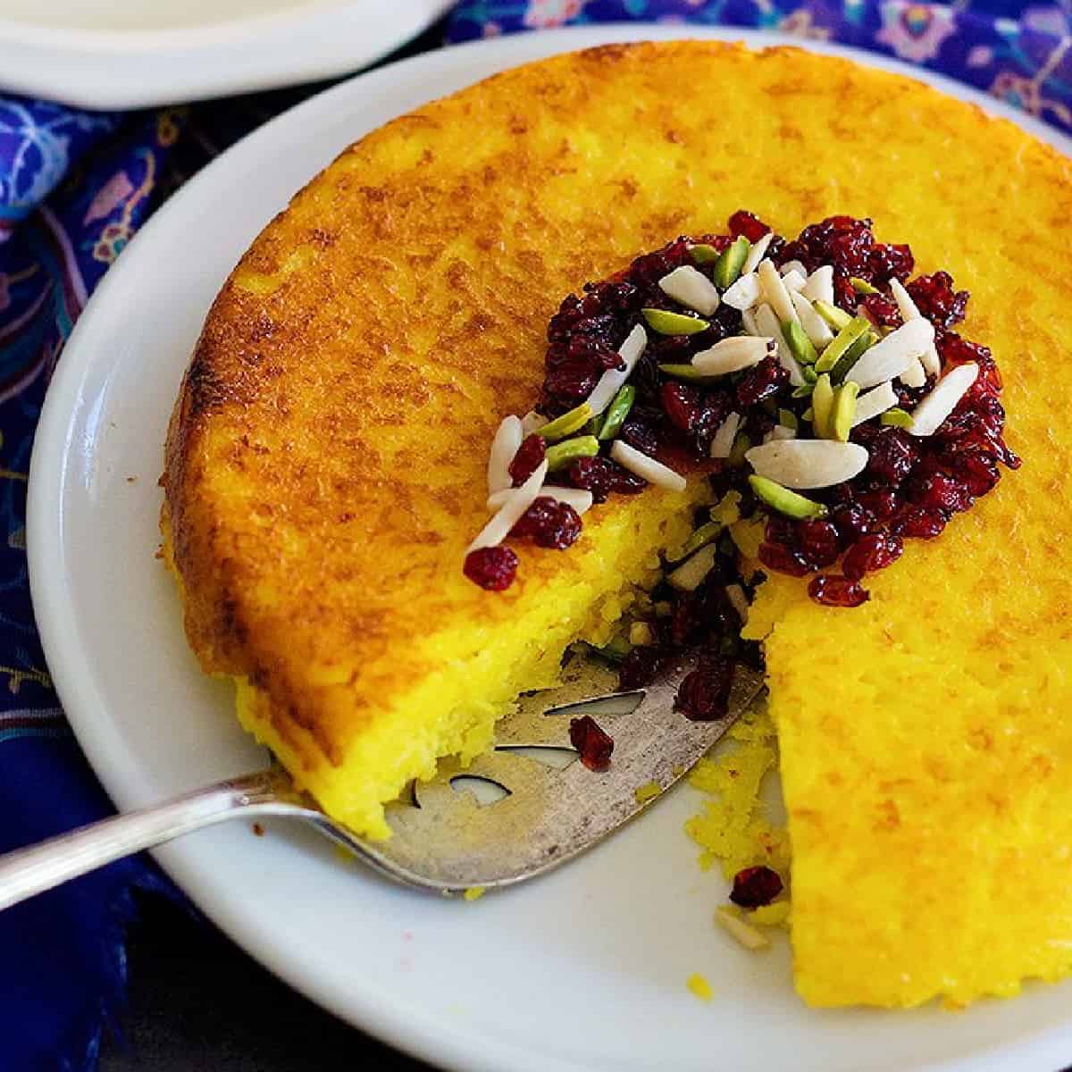 Persian tahchin - savory saffron rice cake on a platter. 