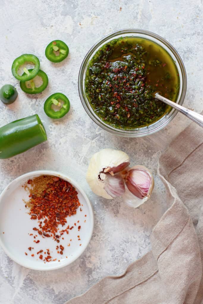 overhead shot of spicy Yemeni cilantro sauce with the ingredients
