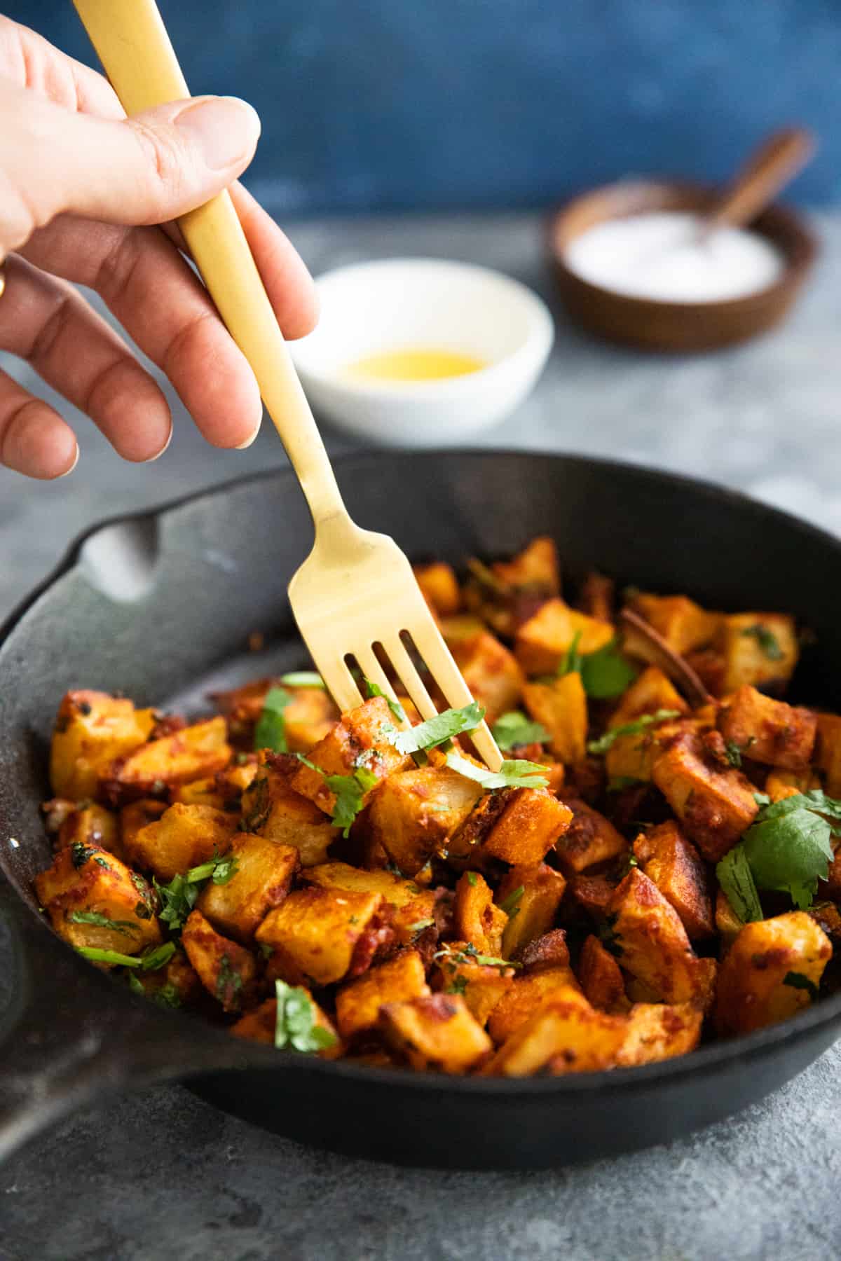 Batata harra is a spicy Middle Eastern potato side dish. It calls for just a few ingredients and is easy to make. Crispy and tender potatoes are tossed in a spicy garlic and cilantro sauce and finished with a squeeze of lemon.
