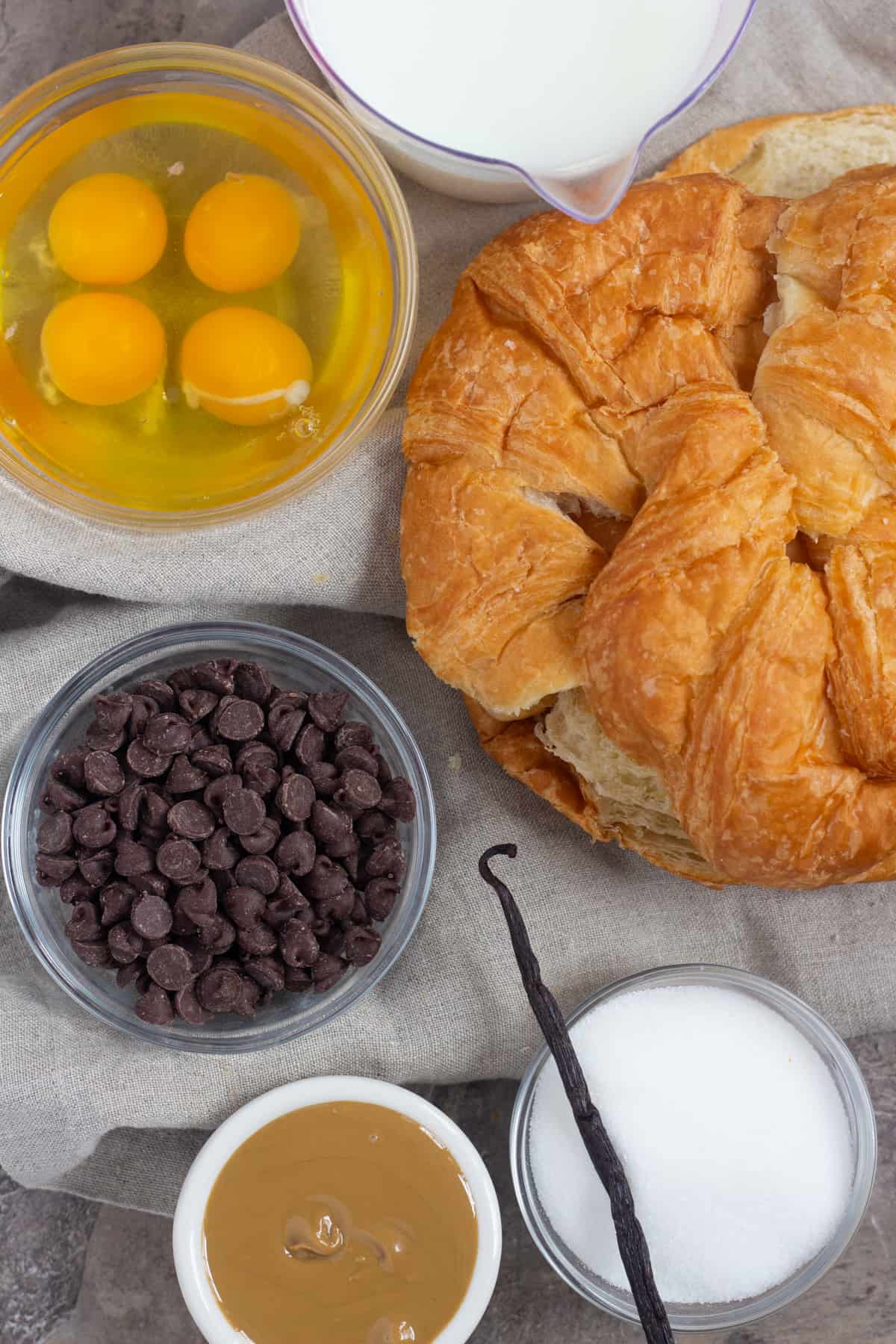 To make croissant bread pudding you need milk, sugar, croissants, eggs and chocolate chips
