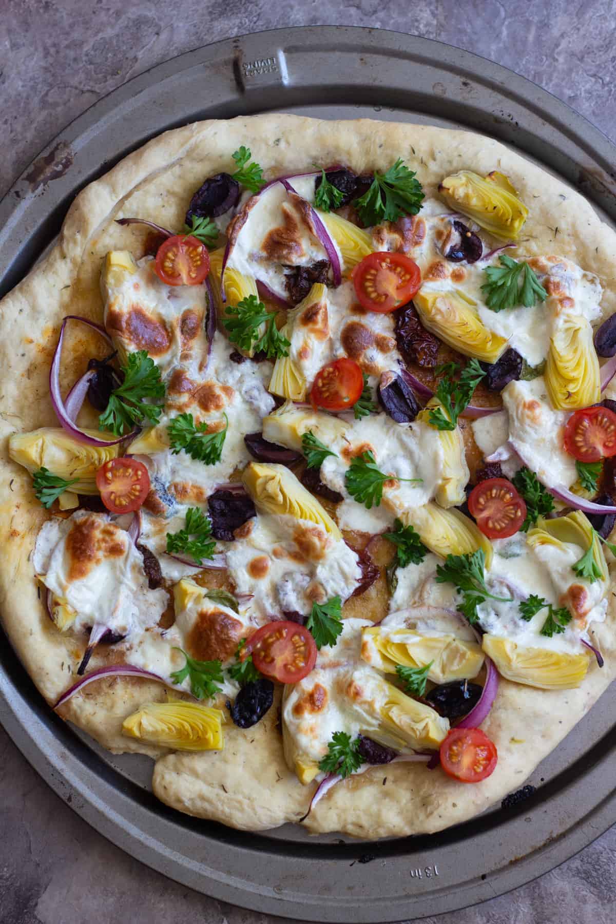 It's best to make the Mediterranean pizza flatbread recipe on a pizza stone.