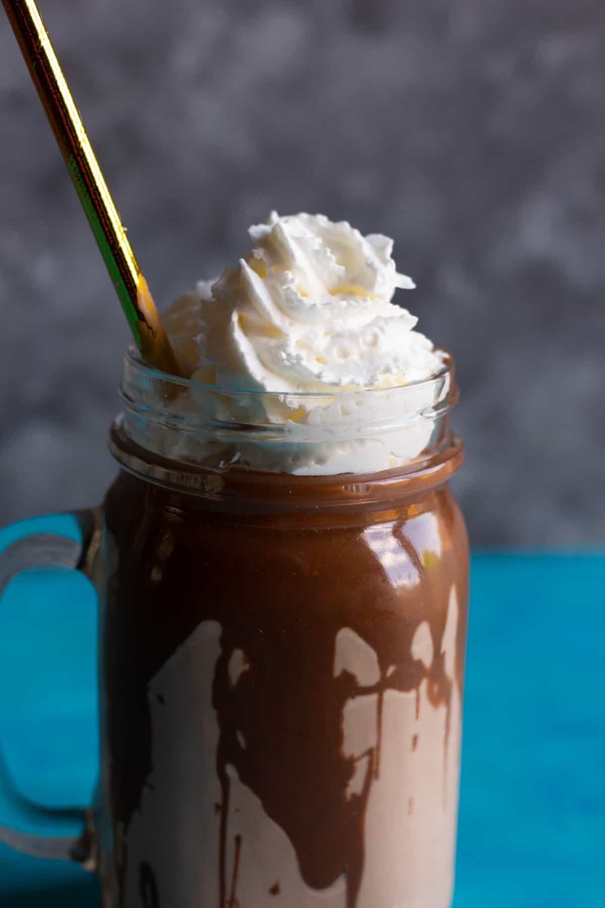 spread nutella inside the glass before pouring the milkshake into it.
