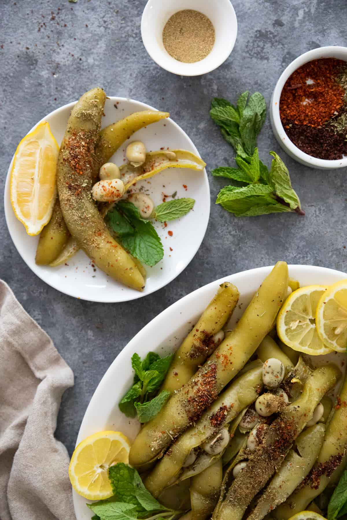 Fava beans out of the pod on a plate and platter. 