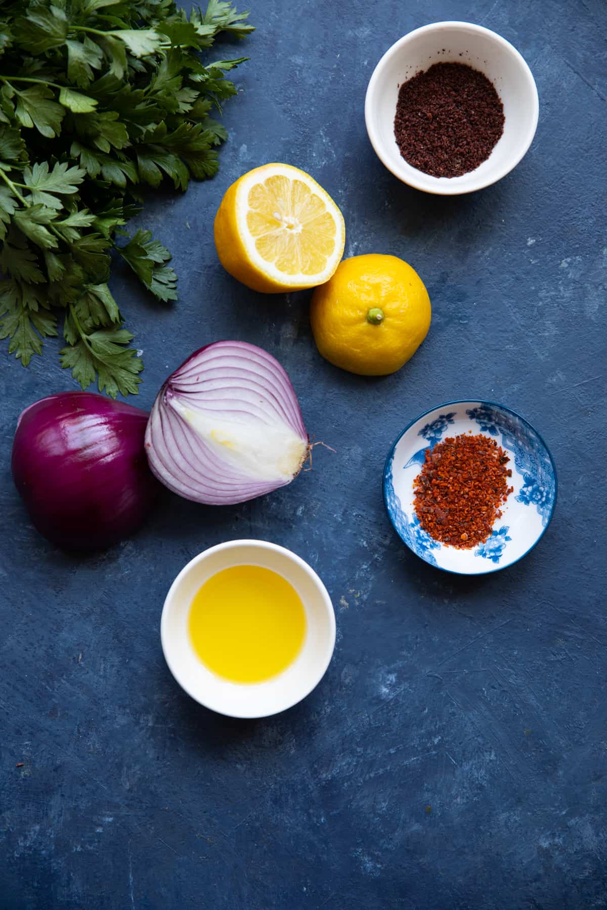 To make Turkish onion and sumac, you need red onion, olive oil, sumac, lemon, parsley and aleppo pepper. 