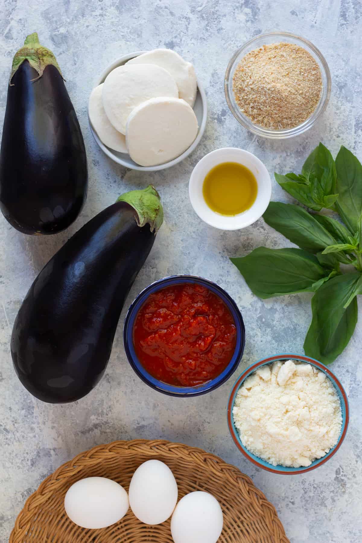 To make eggplant parmesan recipe, you need eggplant, breadcrumbs, eggs, olive oil, parmesan, mozzarella and marinara sauce. 
