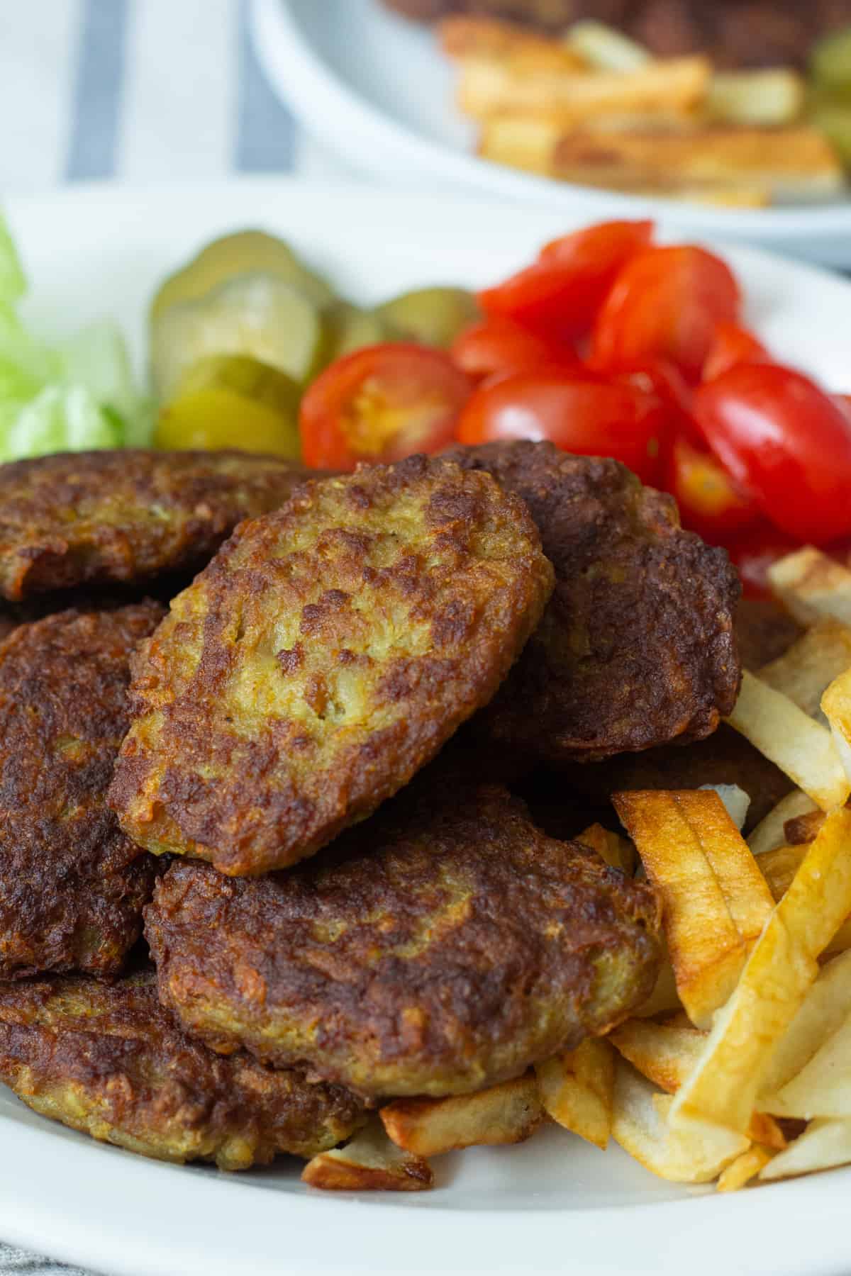 Kotlet is Persian meat patties pan fried in oil and served with French fries. 