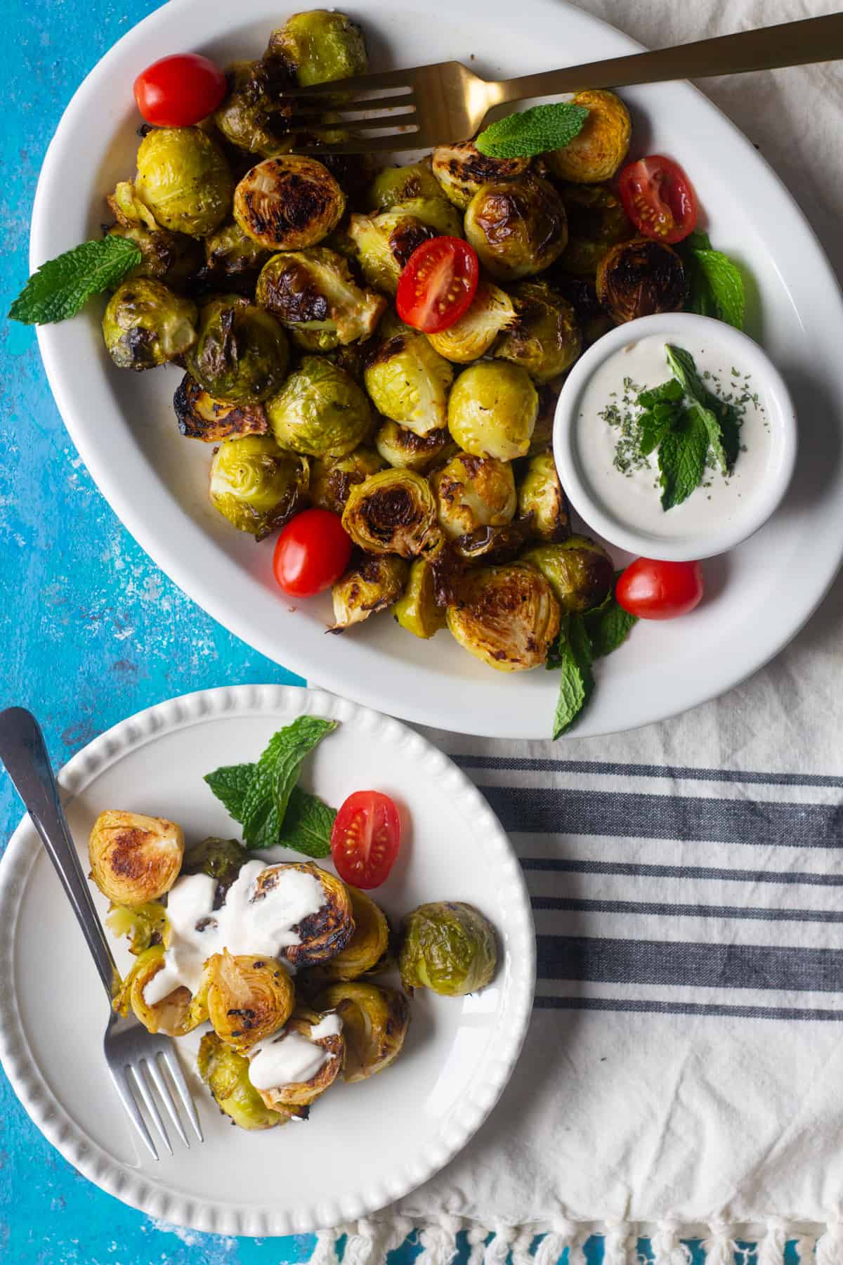 Oven roasted brussel sprouts are easy and ready in 20 minutes. Crispy brussel sprouts roasted in the oven with lemon and garlic make a great side dish. 

