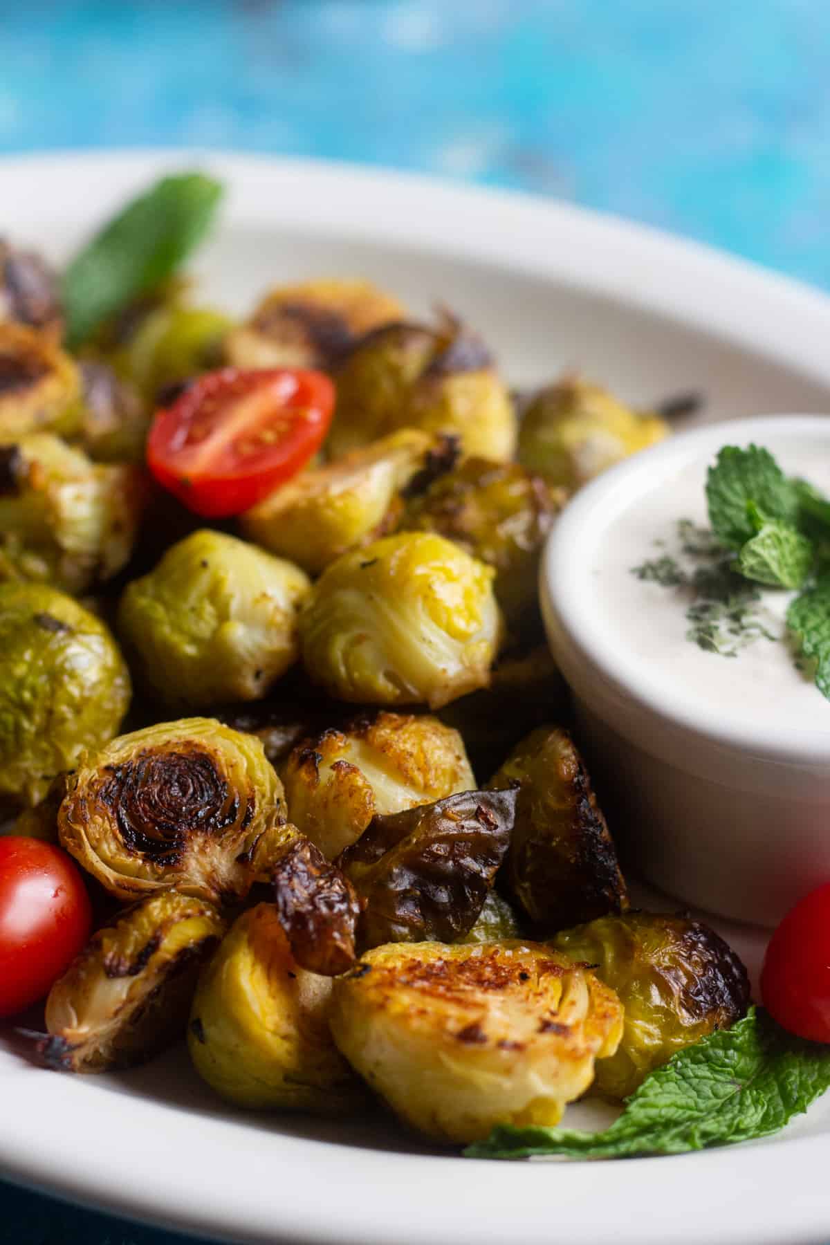 crispy roasted brussel sprouts with tahini yogurt sauce. 