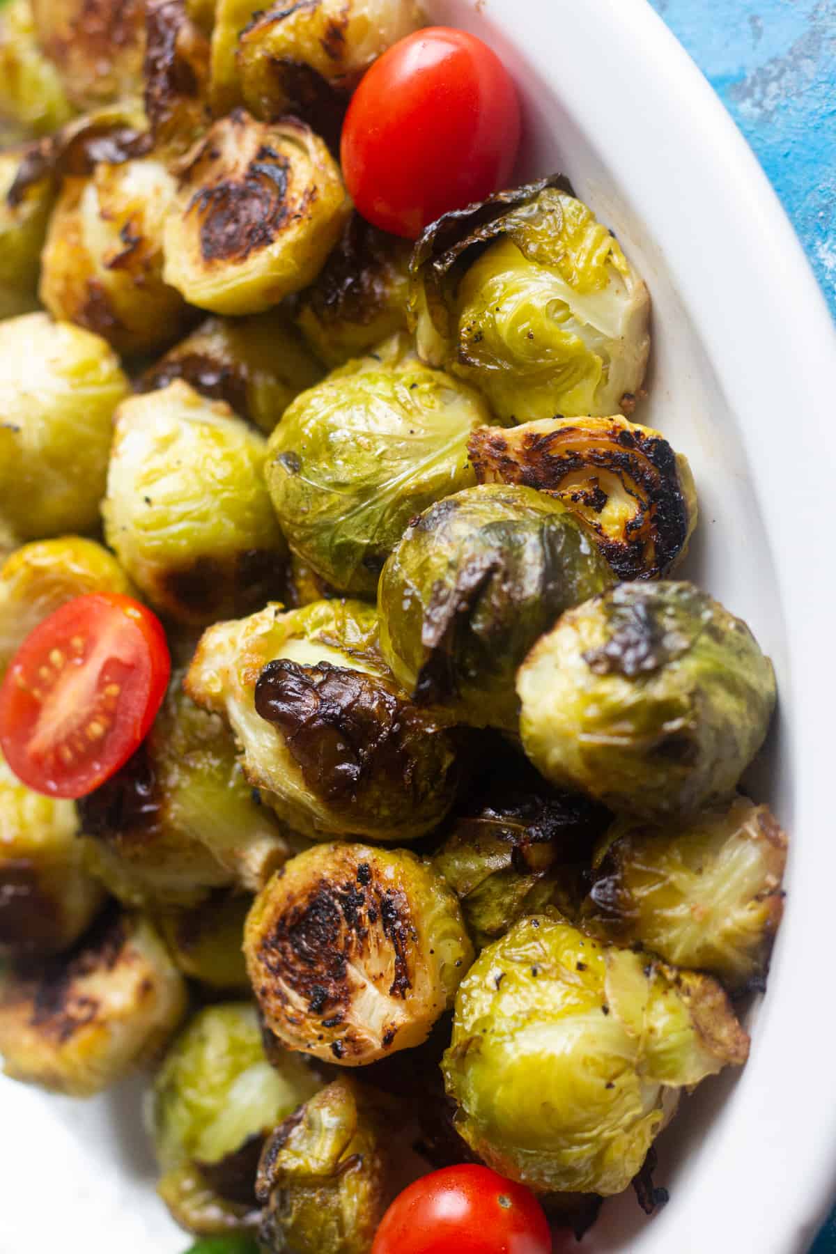 Top crispy sprouts with tomatoes for a pop of color. 