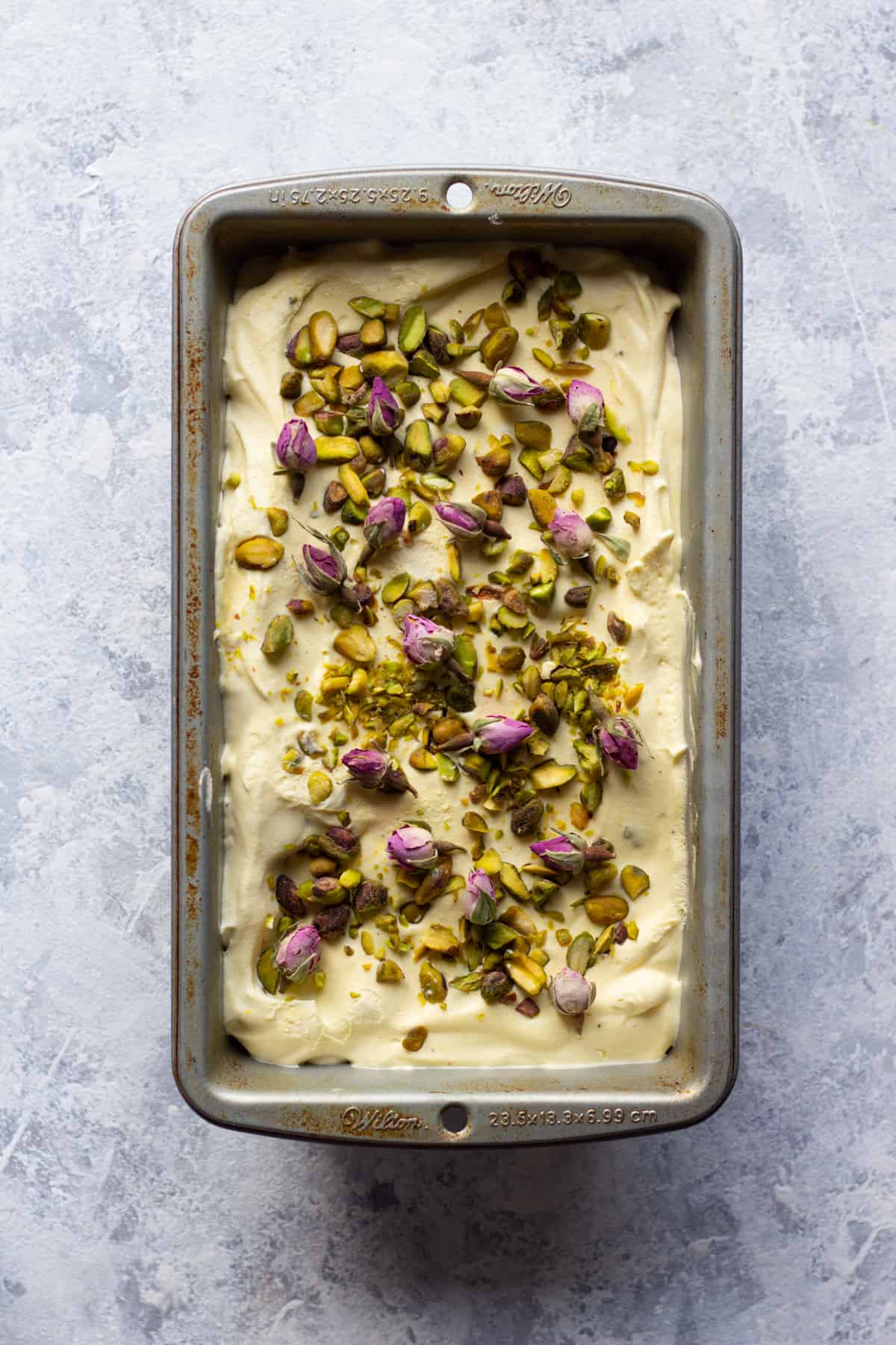 Saffron and pistachio ice cream made in a 9x5 loaf pan.