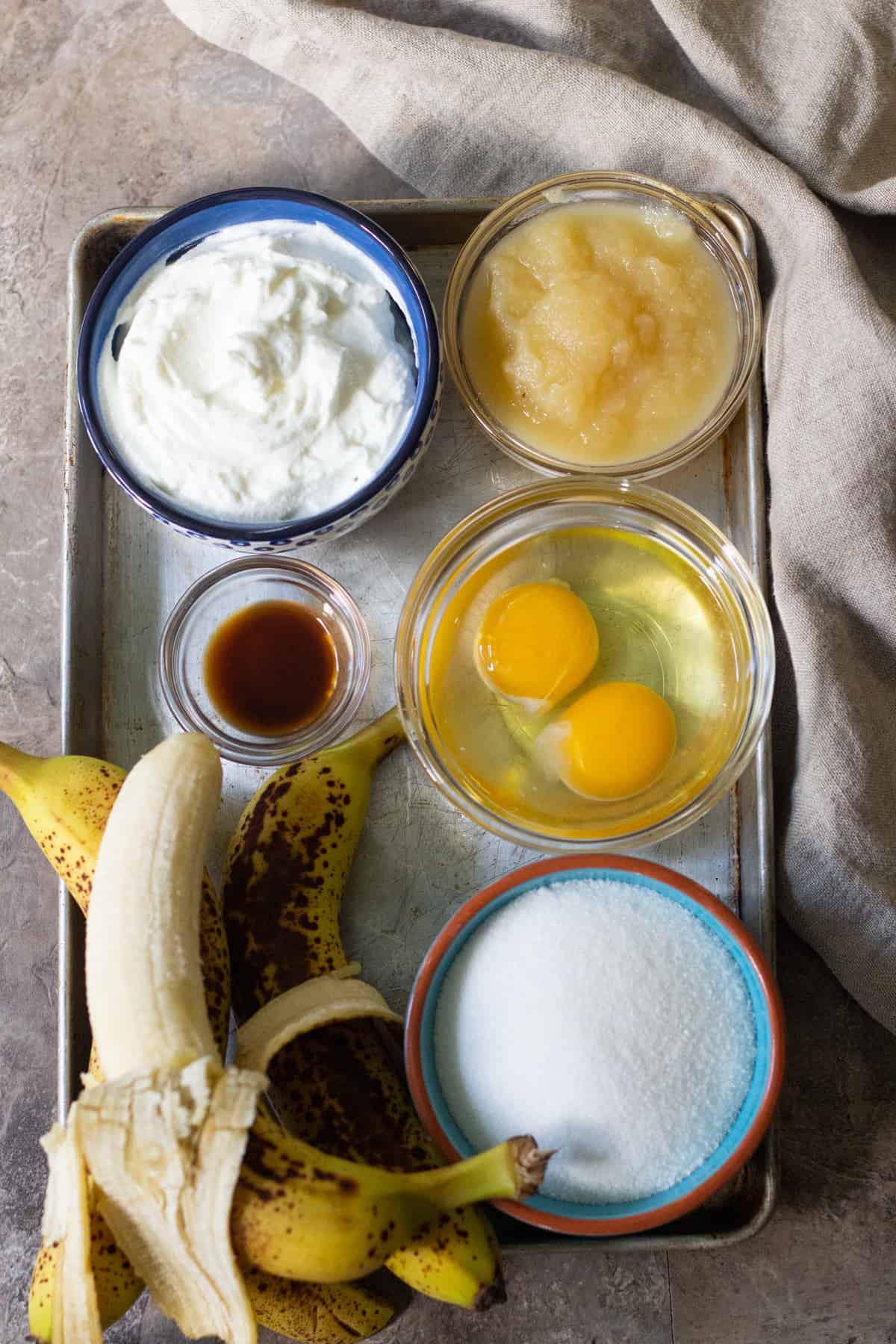 to make healthy banana bread you need applesauce, yogurt, eggs, sugar, bananas and flour. 