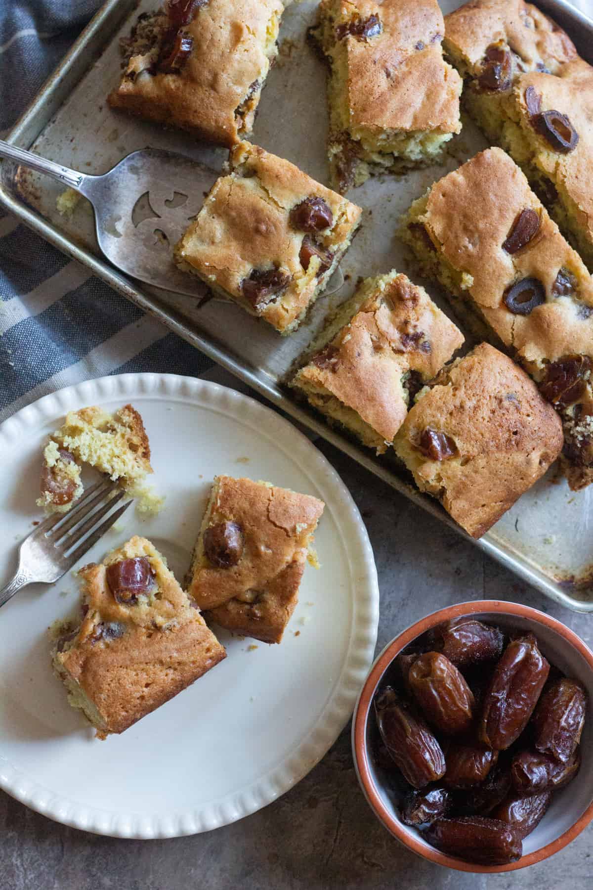 Slices of date cake on a tray. This is an easy cake that's lightly sweetened. 