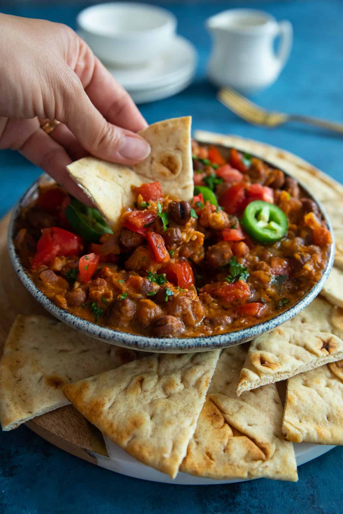 Pita bread dipped in foul mudammas. 