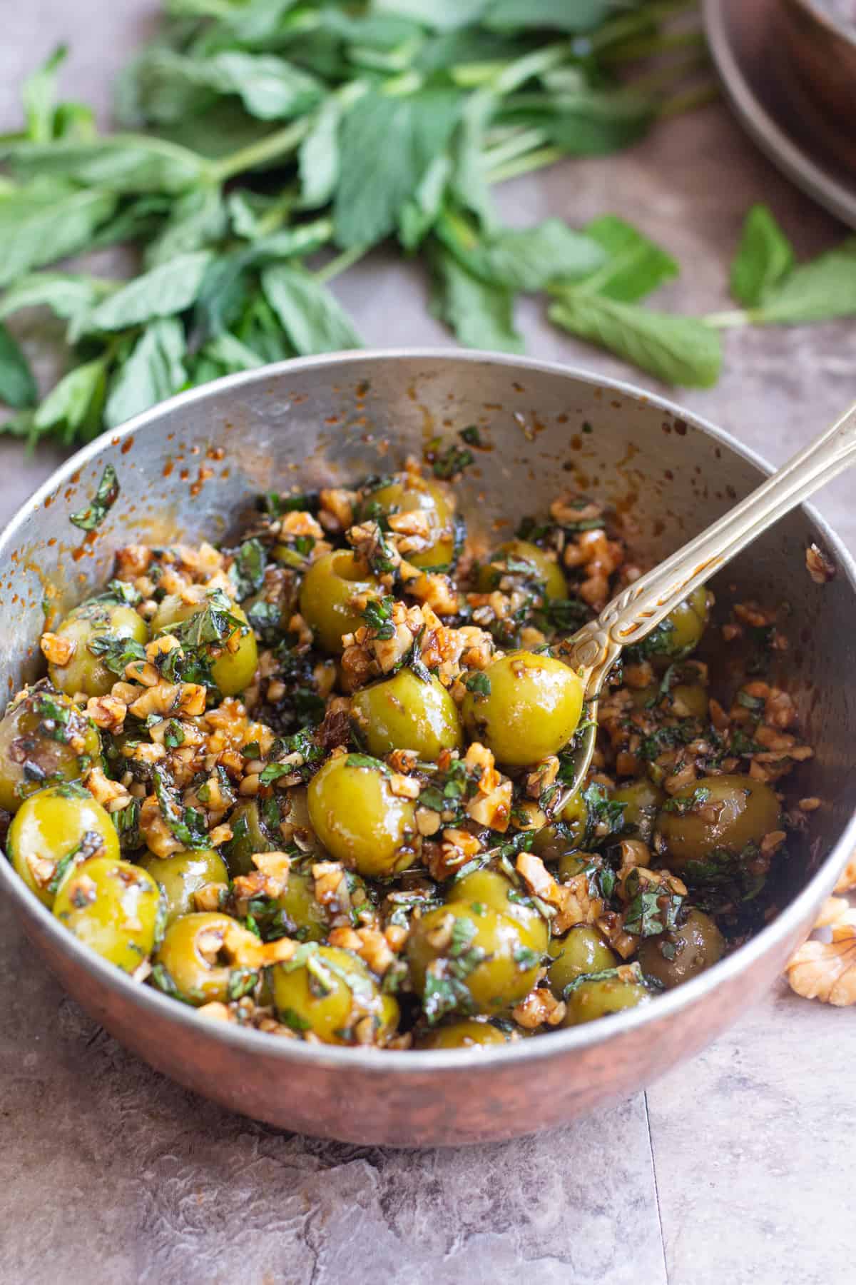 Marinated olives made Persian style with walnuts and pomegranate molasses.