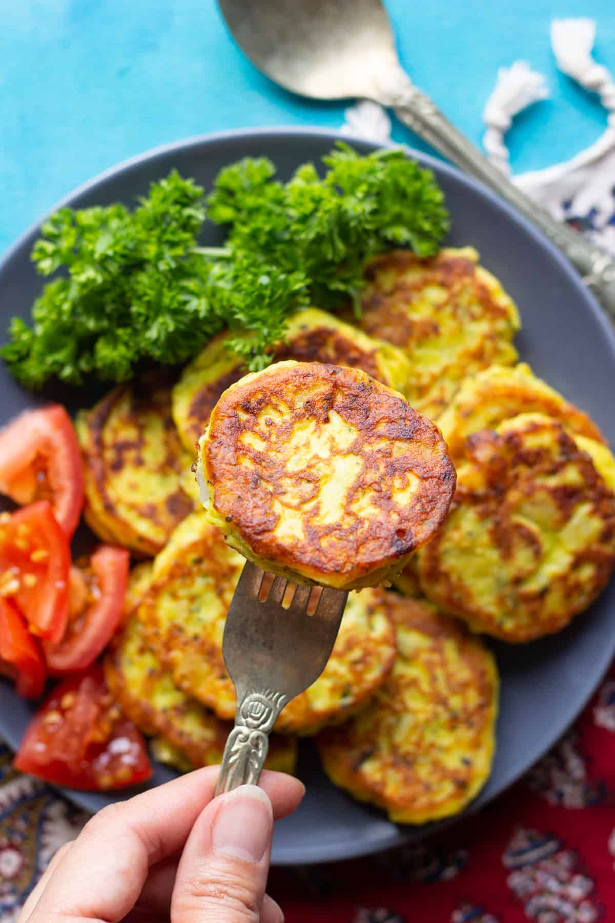 a piece of homemade potato pancake with vegetables. 