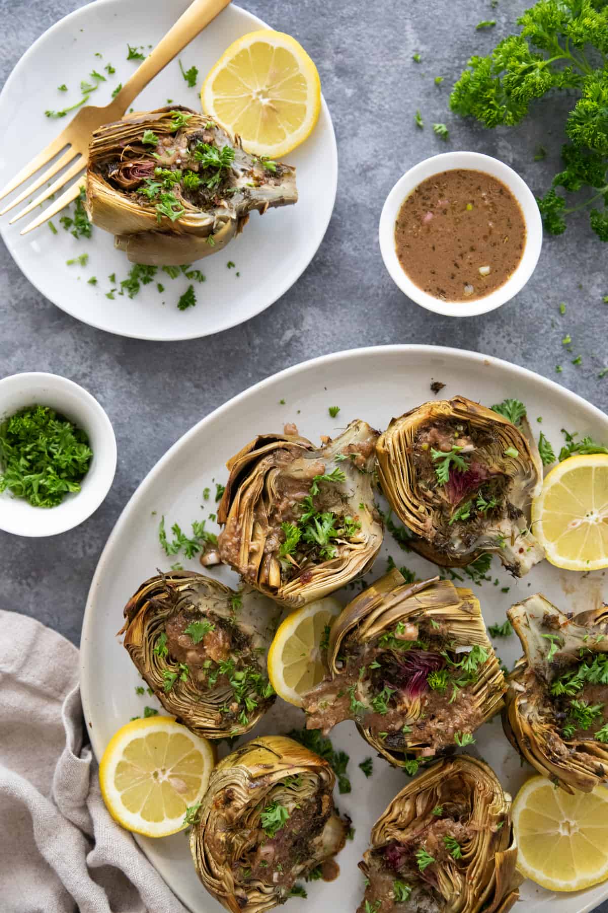 Roasted artichoke is easy to prepare and can be a crowd-pleasing appetizer. Each artichoke is cut in half and roasted to perfection with olive oil, garlic and herbs, making them tender and delicious in every bite.
