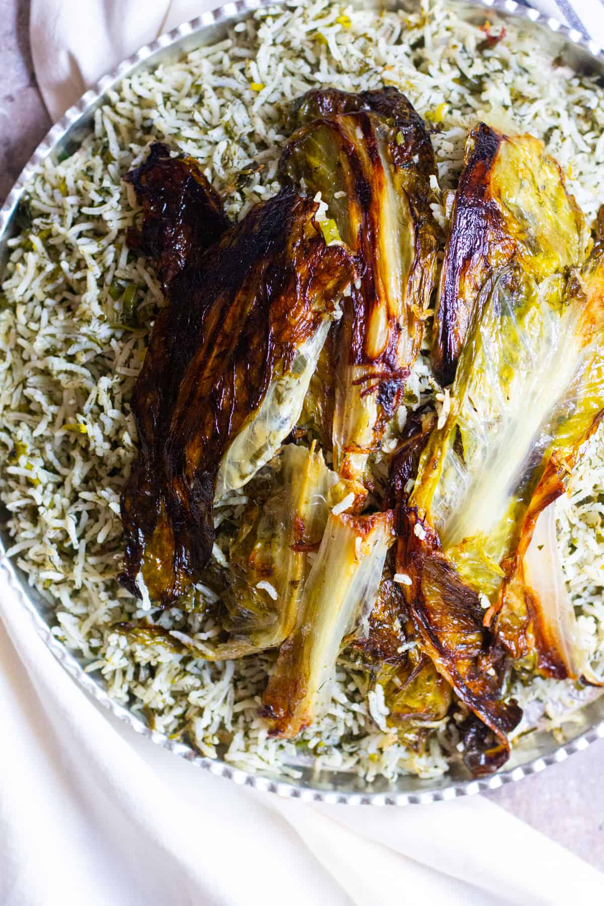 Authentic sabzi polo Persian herb rice with lettuce tahdig. This rice is very aromatic and tasty.