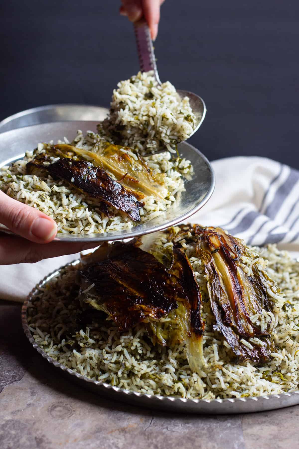 Sabzi Polo is a delicious Persian Herb Rice that is usually served with fish for the new year. Sabzi Polo has a crispy lettuce Tahdig that's hard to resist! 
