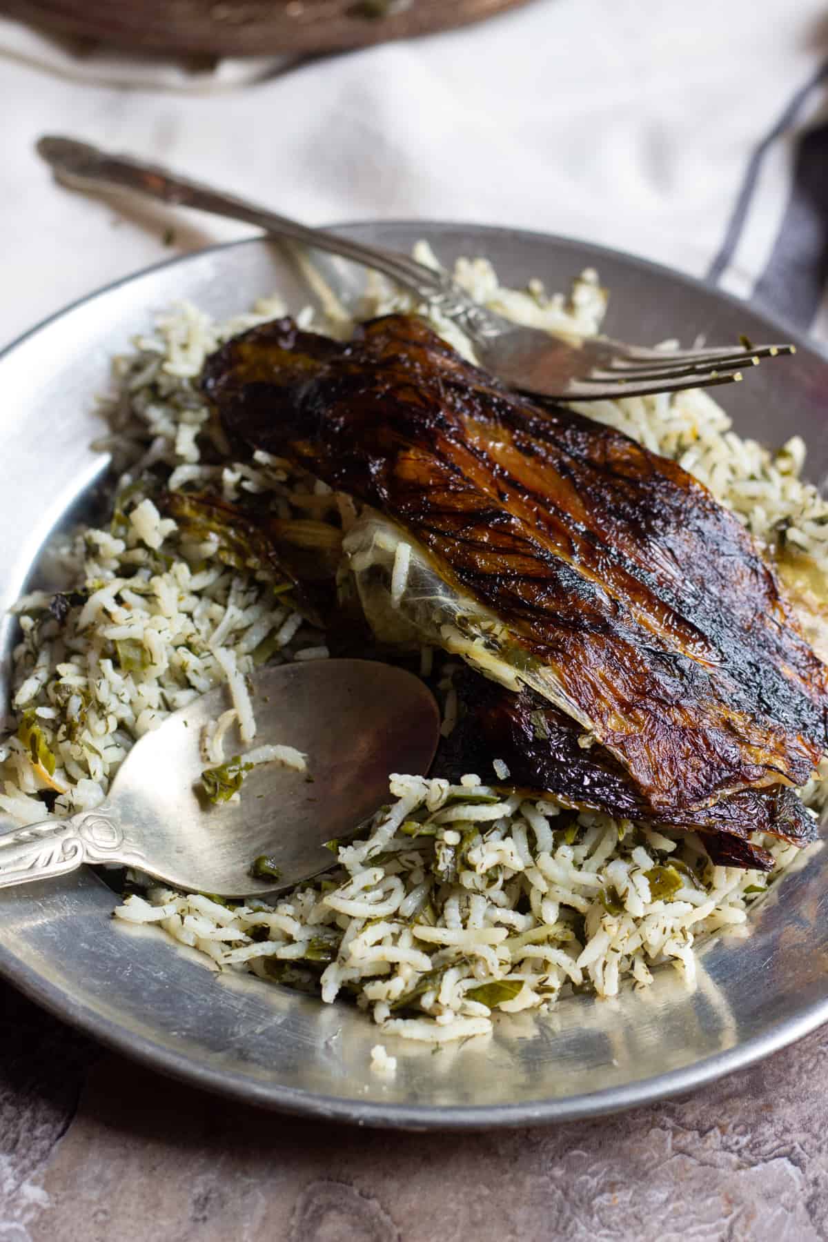 Sabzi Polo is a delicious Persian Herb Rice that is usually served with fish for the new year. Sabzi Polo has a crispy lettuce Tahdig that's hard to resist! 
