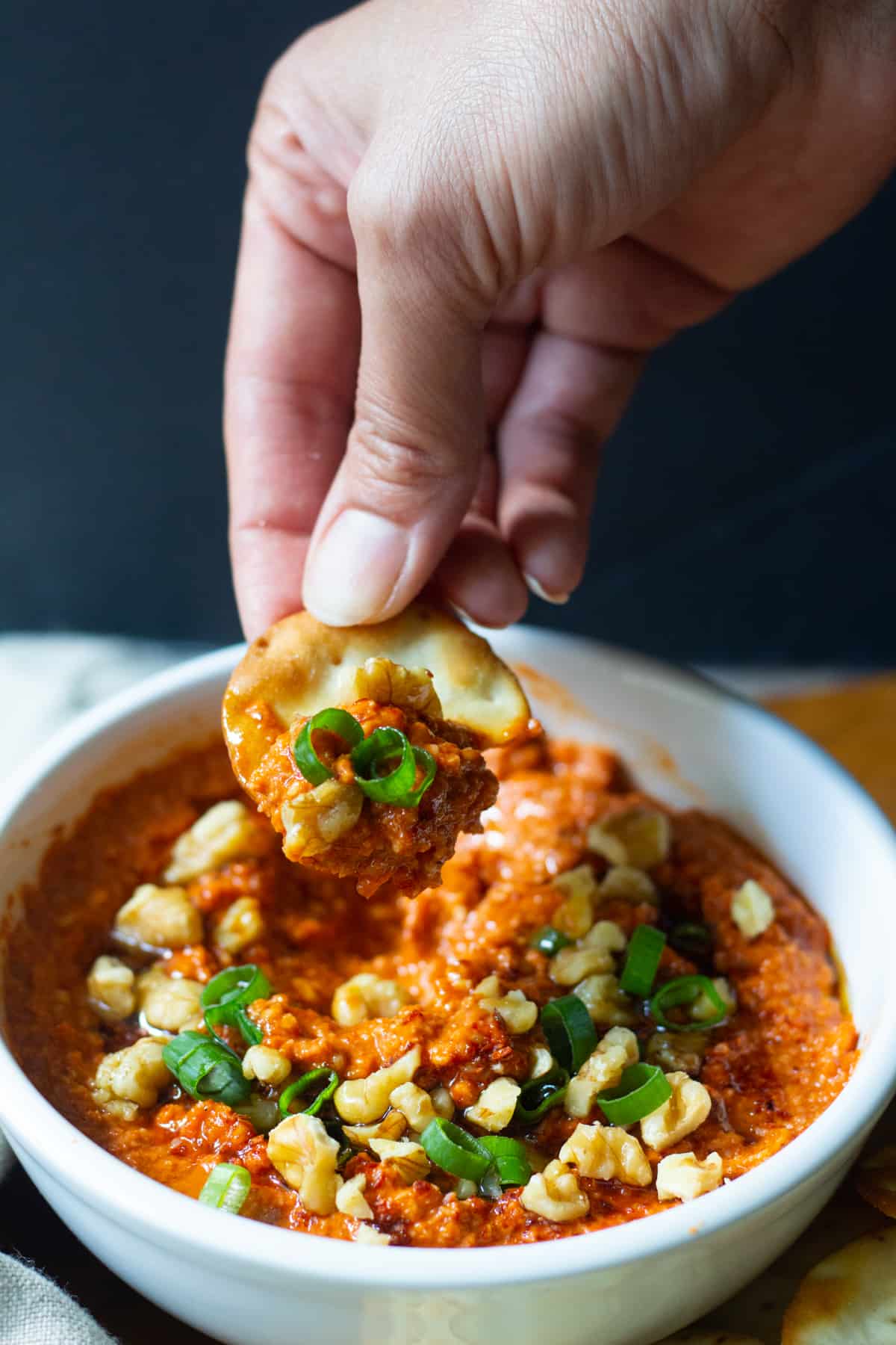 Muhammara is a tasty roasted red pepper dip from Aleppo, Syria. This classic Muhammara recipe is made with roasted red peppers, walnuts and olive oil.