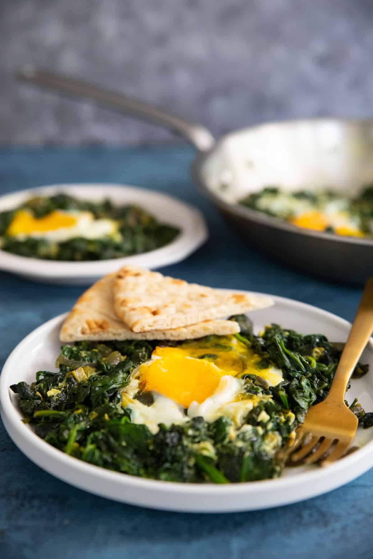 Spinach and eggs, Persian style! This one pan breakfast is easy, healthy and ready in only 20 minutes. You only need a handful of ingredients to make this delicious egg recipe.
