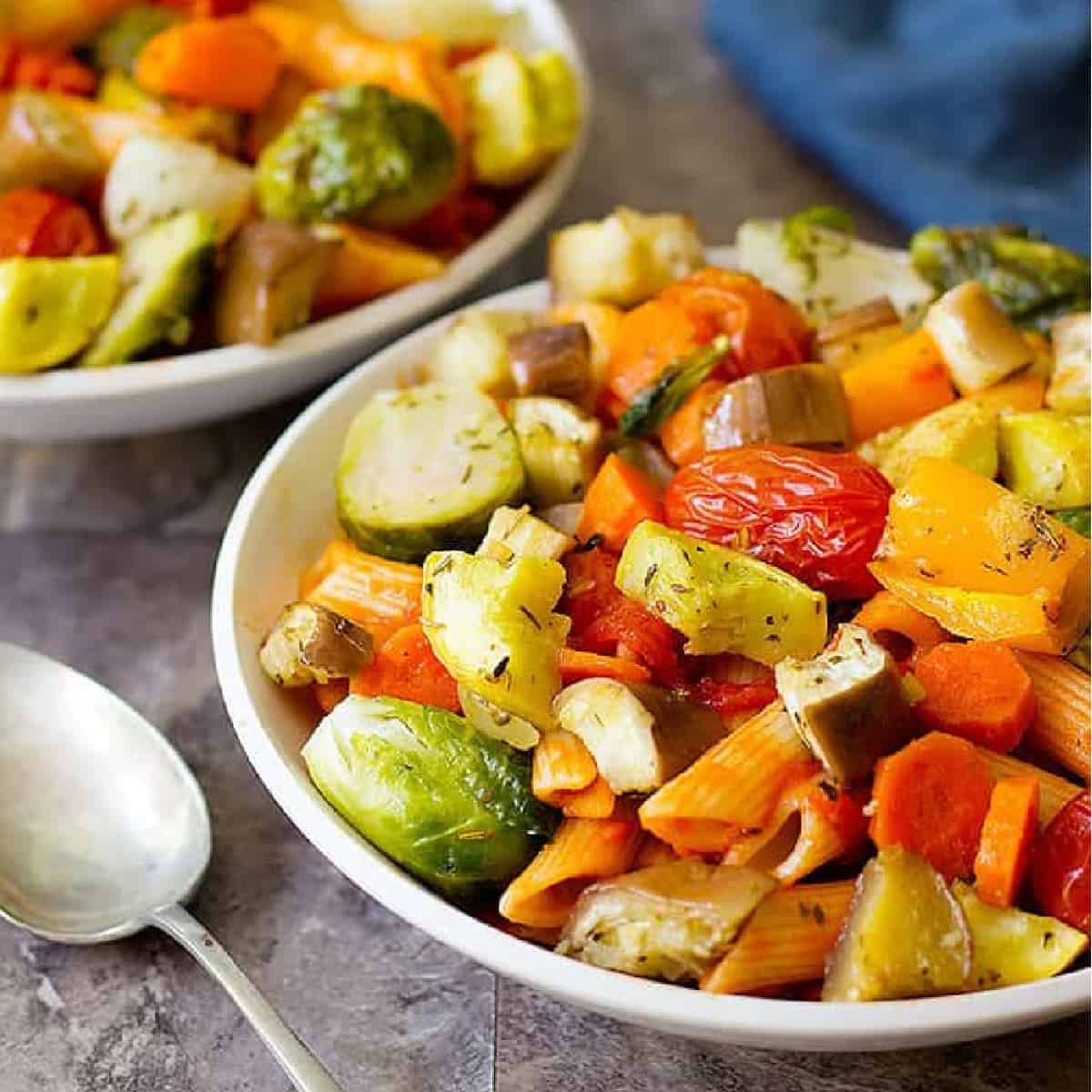 roasted vegetables with pasta in a bowl. 