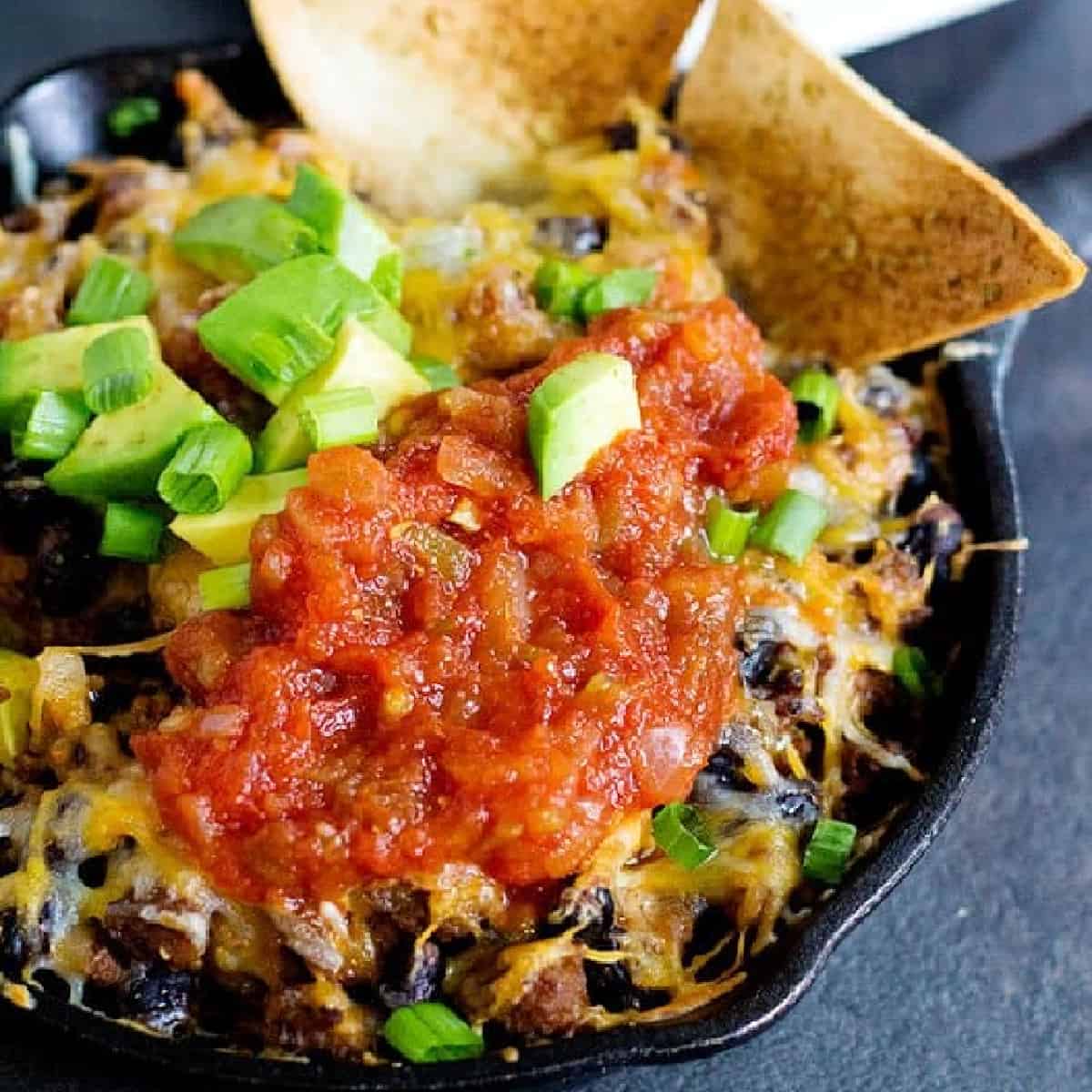 This cheesy taco dip will be the star of your parties and gathering! Serve it with homemade rosemary garlic tortilla chips for more flavor! Game days are going to be delicious!
