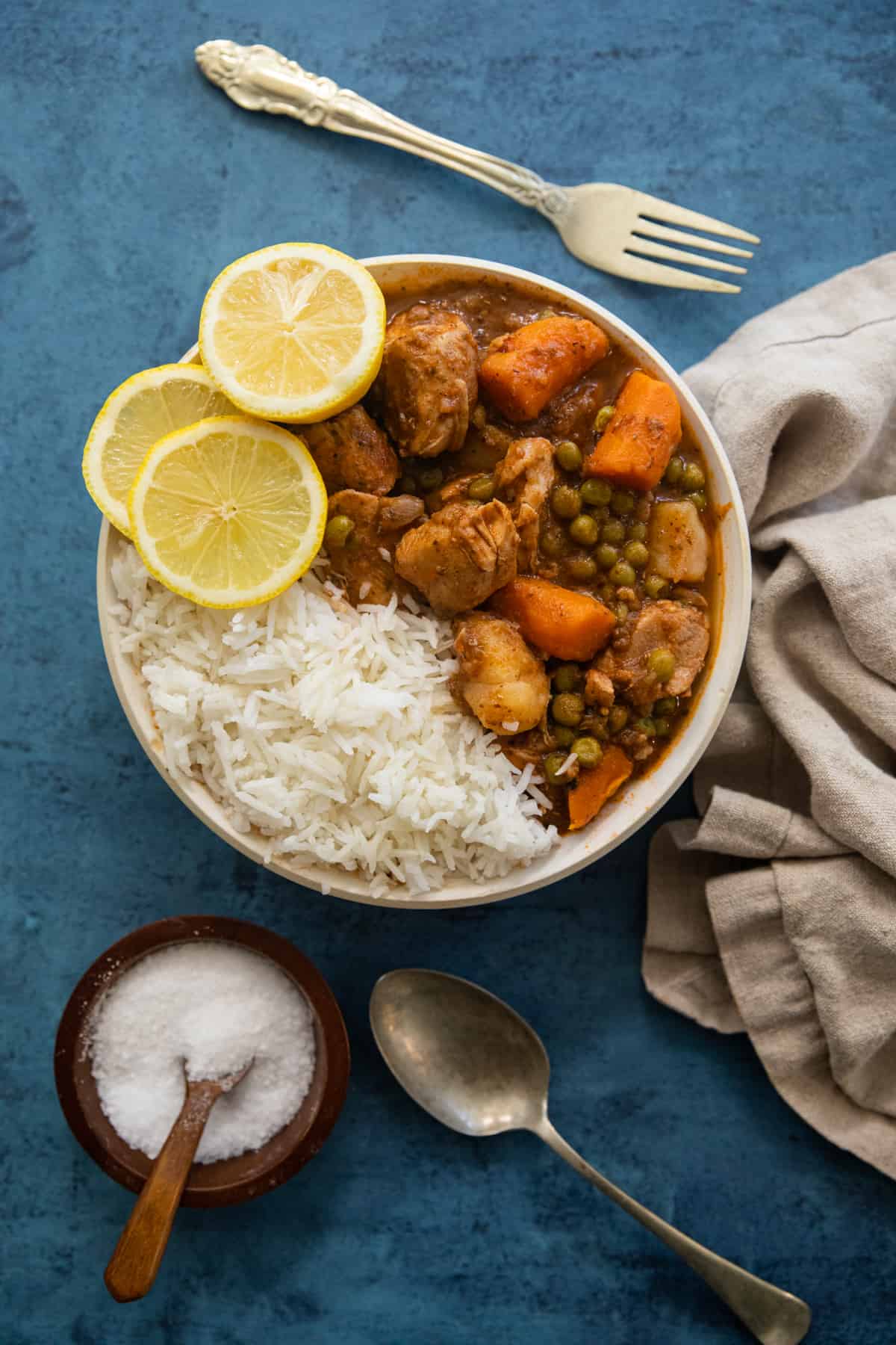 a bowl of stewed chicken with rice. 